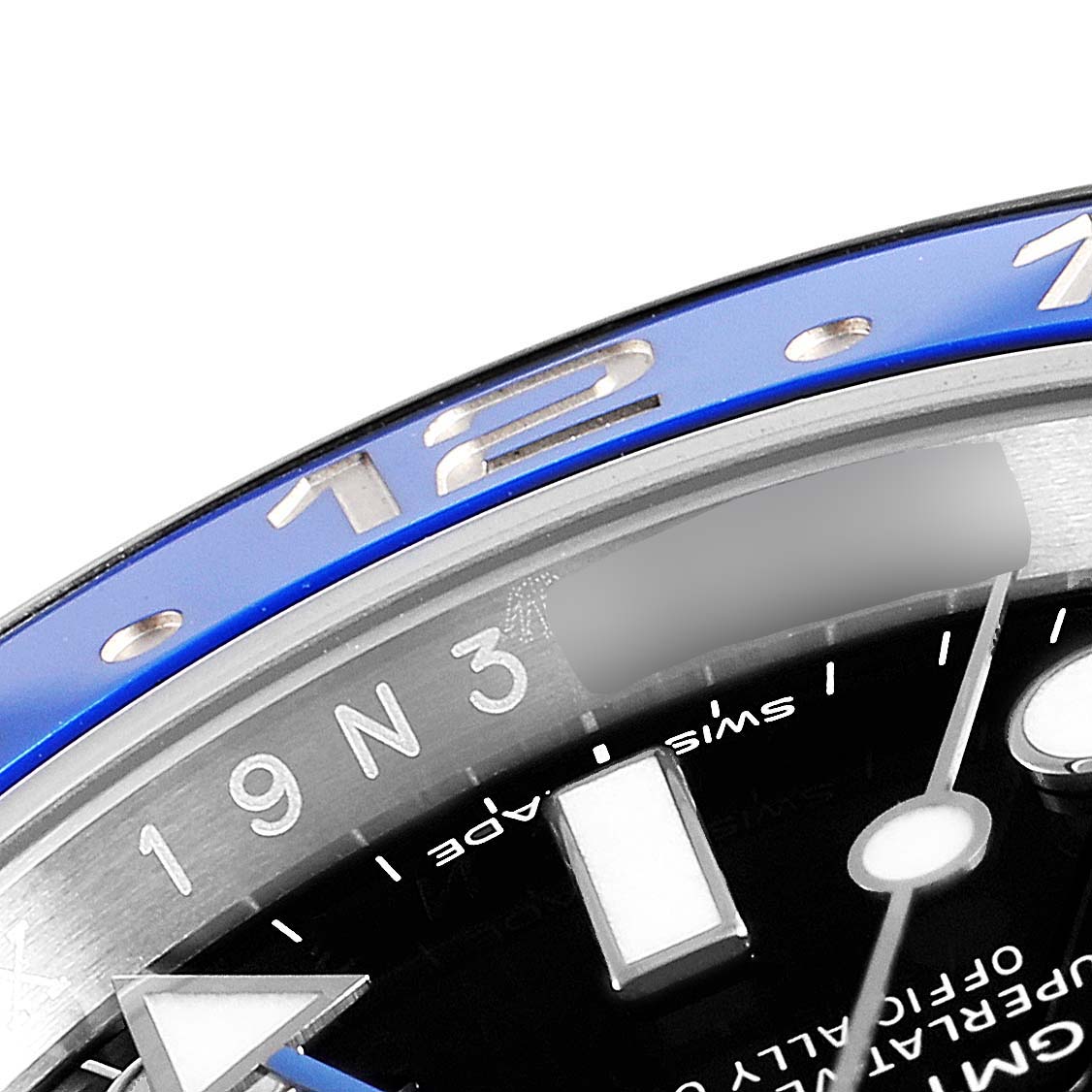 This close-up of the Rolex GMT-Master 116710 Men
s Stainless Steel Black Dial 116710 Men
s Stainless Steel Black Dial watch shows part of the blue bezel, including the 12-hour marker, and the black dial with hour indicators.