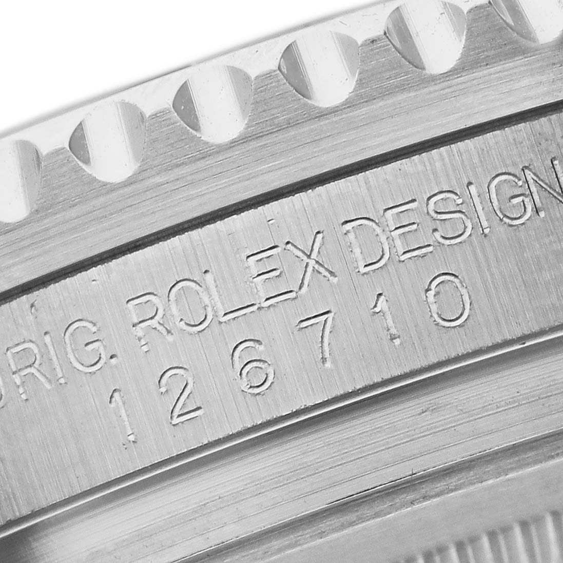 The image shows a close-up of the side view of the Rolex GMT-Master 12671 Men's Stainless Steel Black Dial 12671 Men's Stainless Steel Black Dial, highlighting the engraved model number and design details.