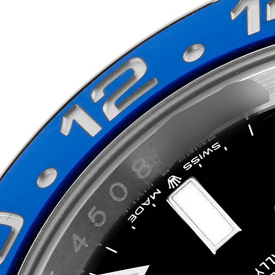 The image shows a close-up of the bezel and face of a Rolex GMT-Master 12671 Men's Stainless Steel Black Dial 12671 Men's Stainless Steel Black Dial, highlighting the blue color and part of the dial.