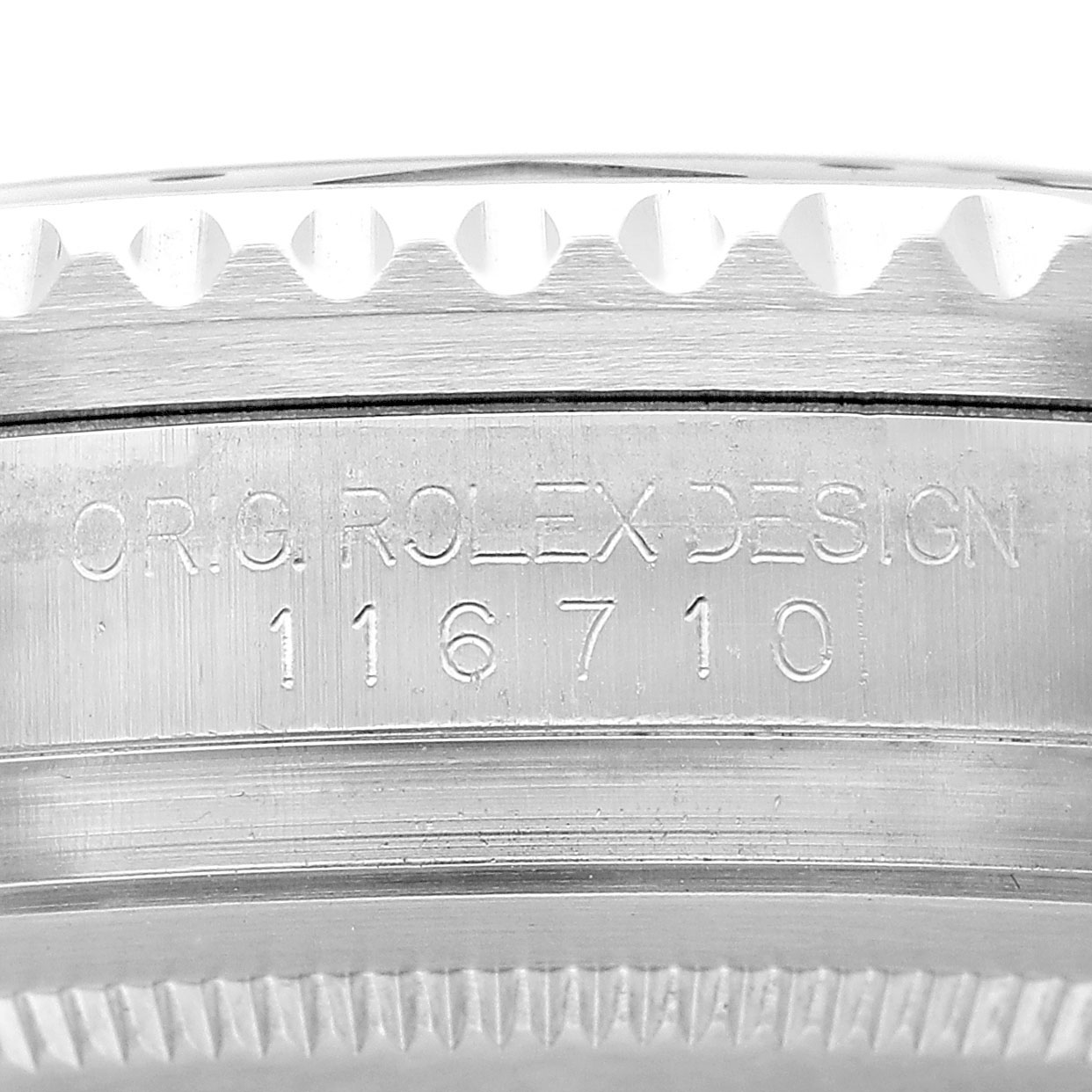 This image shows the side engraving on the case of a Rolex GMT-Master 116710 Men's Stainless Steel Black Dial, displaying the model number and "ORIG. ROLEX DESIGN."