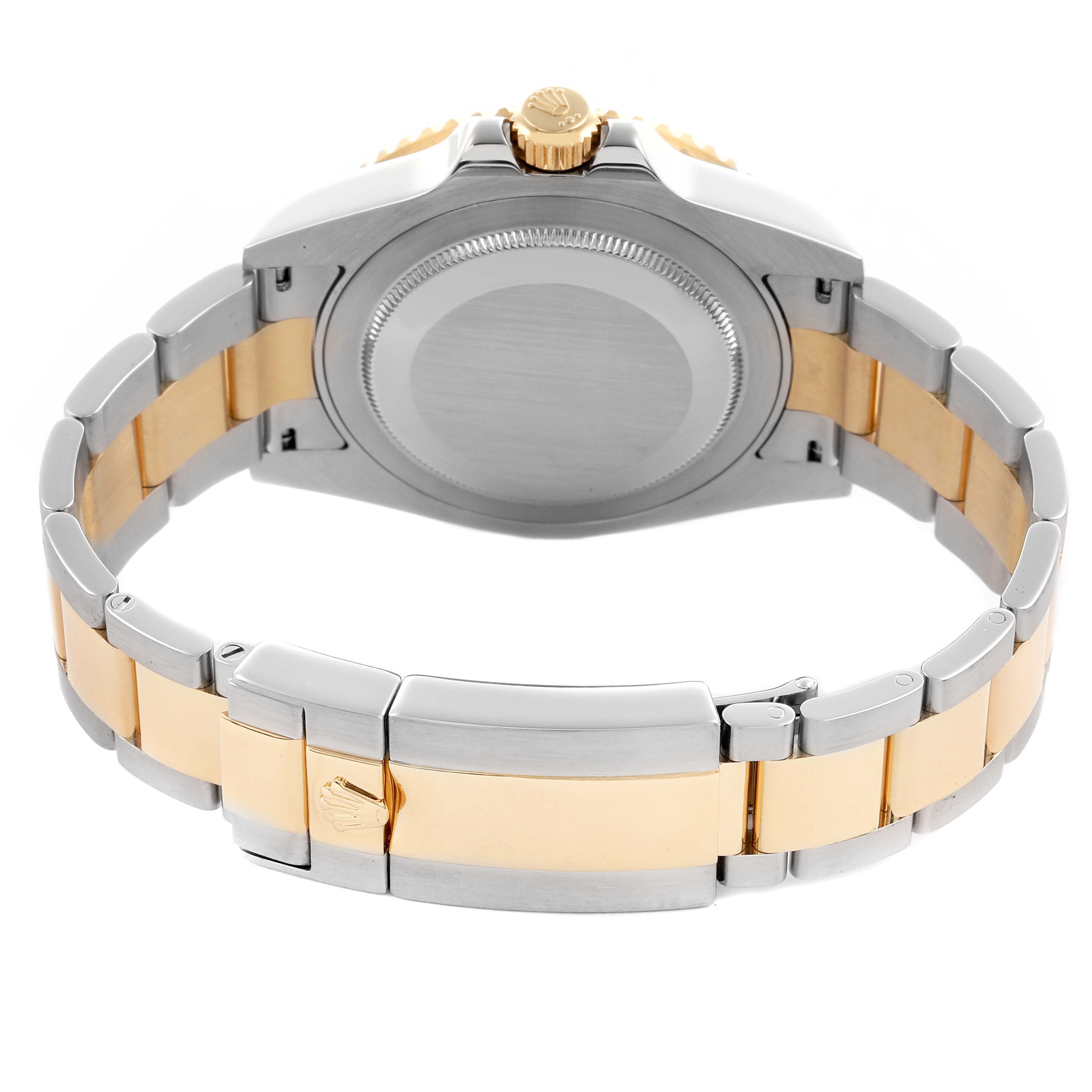 The Rolex GMT-Master 116713 Men's Steel and Gold (two tone) Black Dial 116713 Men's Steel and Gold (two tone) Black Dial is shown from the back, highlighting the case back and two-tone bracelet.