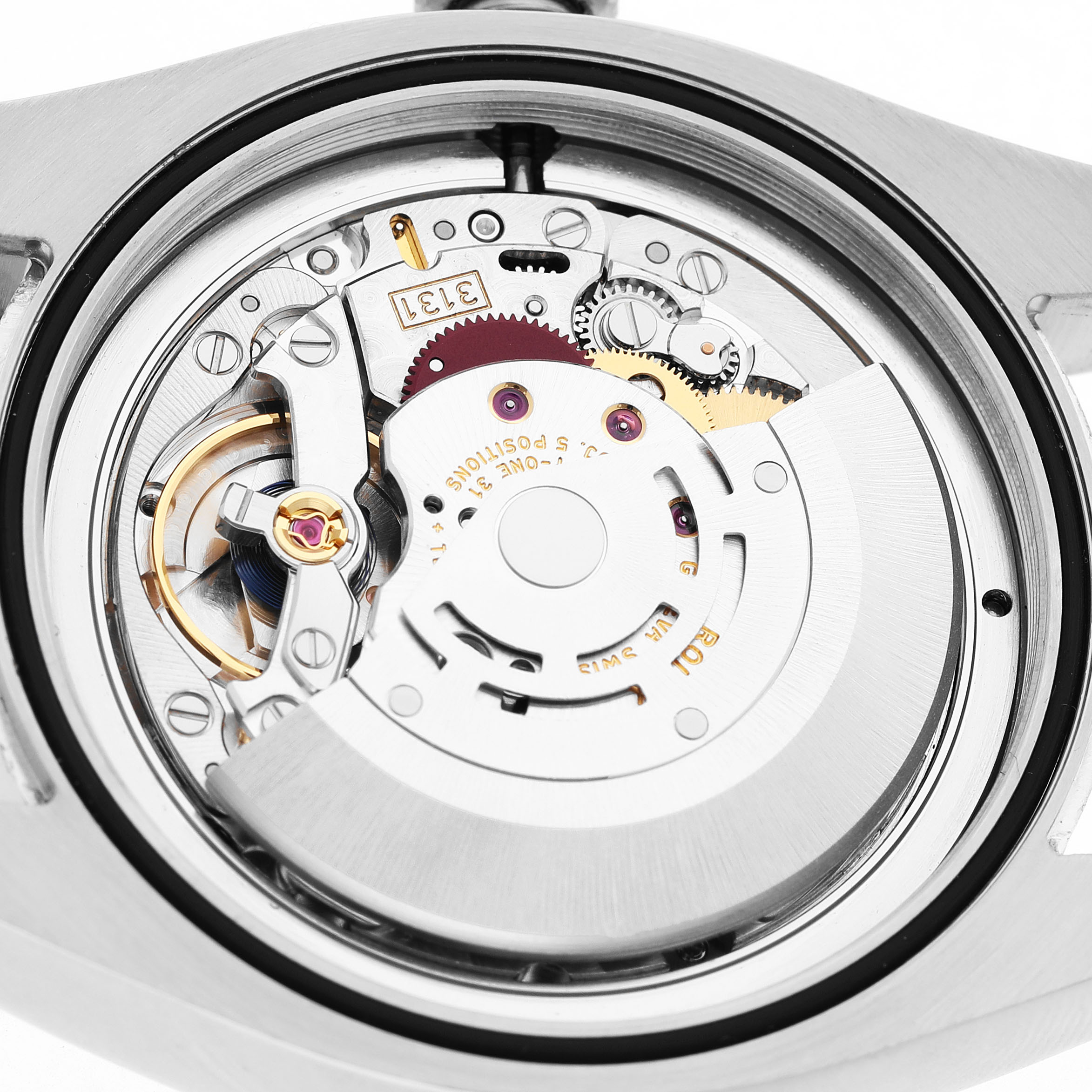 The image shows the back view of a Rolex Milgauss 116400 Men's Stainless Steel White Dial watch, highlighting its intricate movement components.