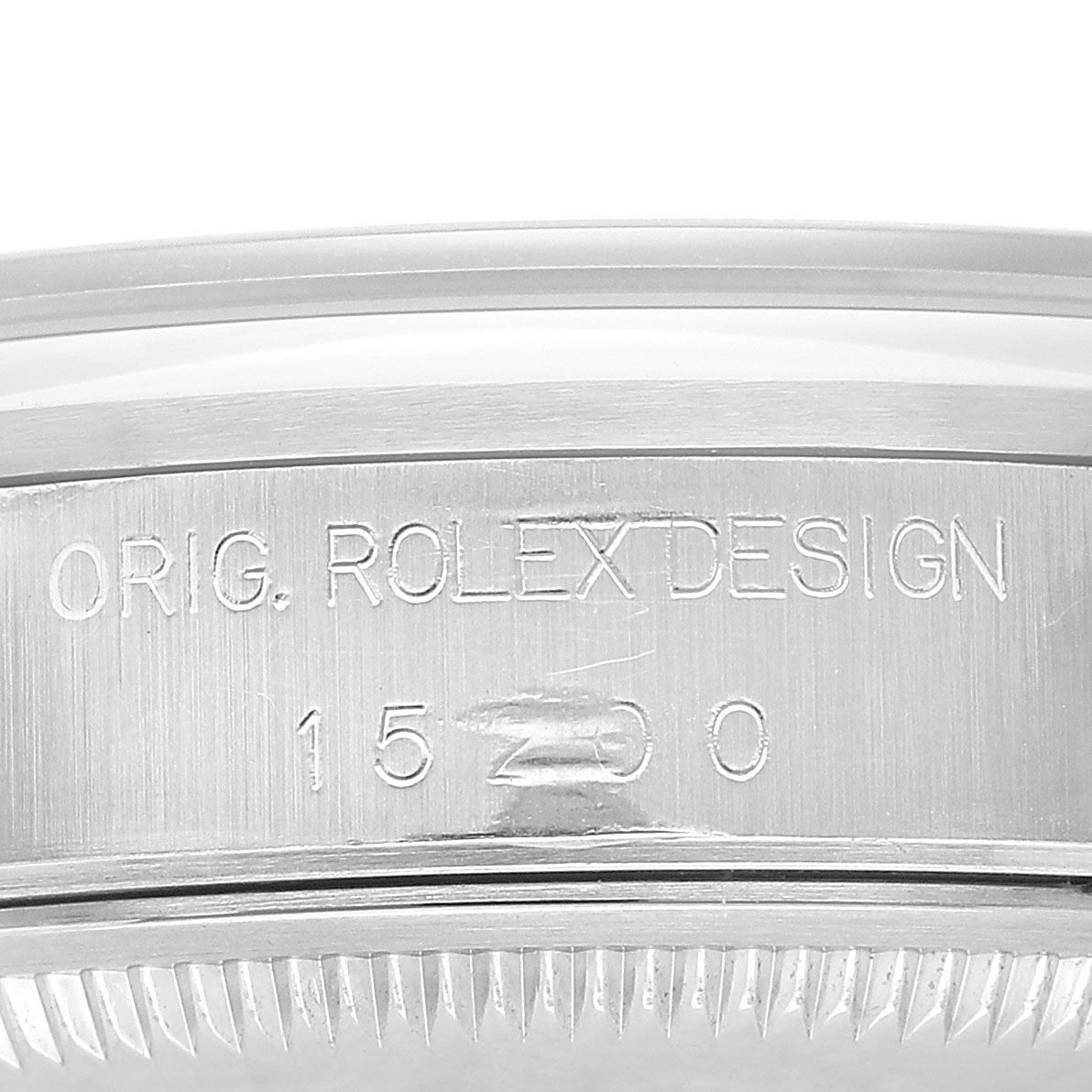 The image shows the side of the Rolex Date 15200 Men's Stainless Steel Black Dial model, focusing on the engraved "ORIG. ROLEX DESIGN" and model number.