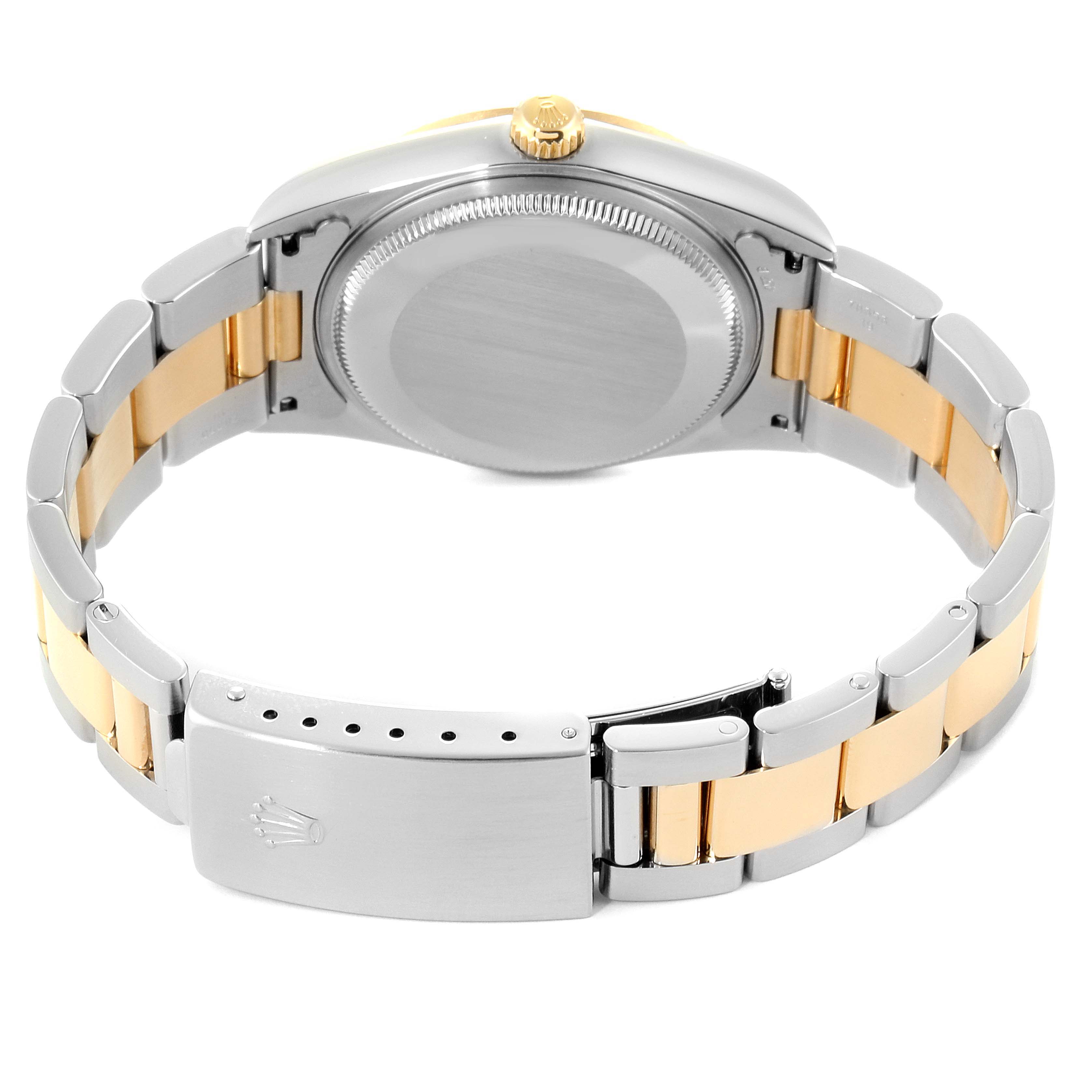 This image shows the back and clasp of a Rolex Oyster Perpetual 14233 Men's Steel and Gold (two tone) Silver Dial 14233 Men's Steel and Gold (two tone) Silver Dial watch, highlighting its two-tone bracelet and crown.