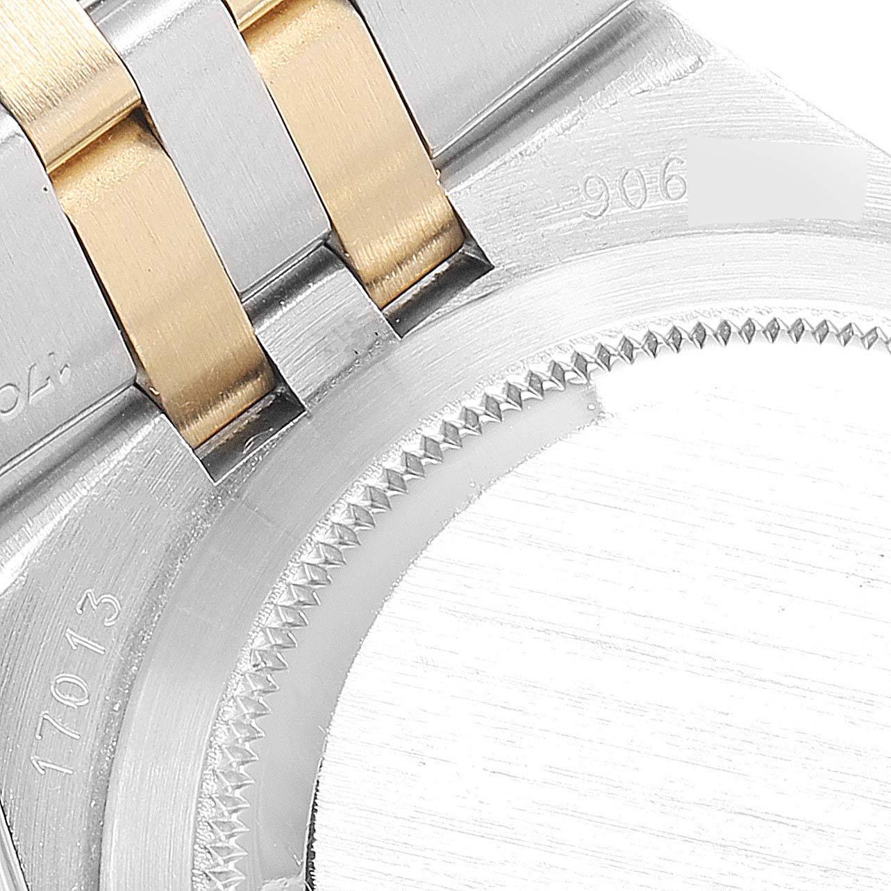 The image shows a close-up of the bracelet and part of the case back of a Rolex Oysterquartz 17013 Men's Steel and Gold (two tone) Champagne Dial 17013 Men's Steel and Gold (two tone) Champagne Dial watch.