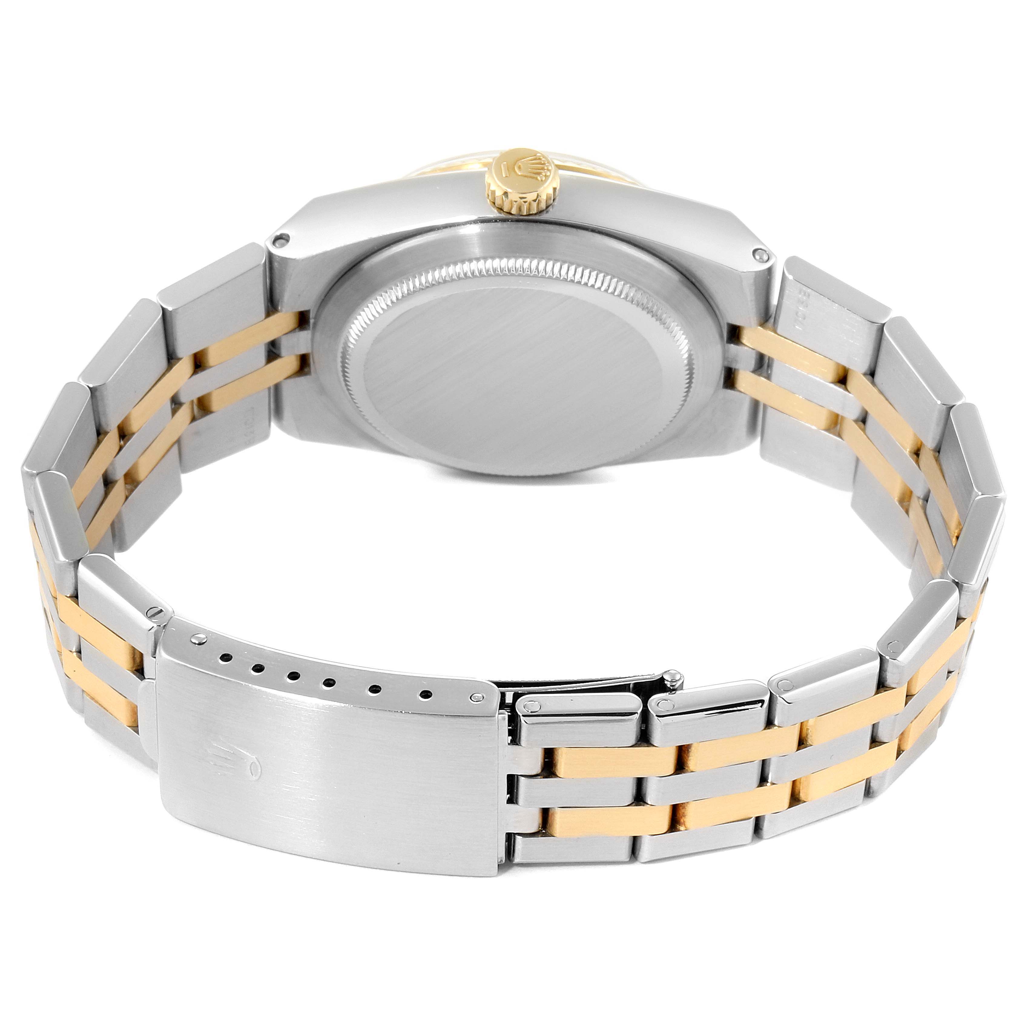 The image shows the back view of the Rolex Oysterquartz 17013 Men's Steel and Gold (two tone) Champagne Dial 17013 Men's Steel and Gold (two tone) Champagne Dial watch, highlighting its case back, crown, and two-tone bracelet with a clasp.