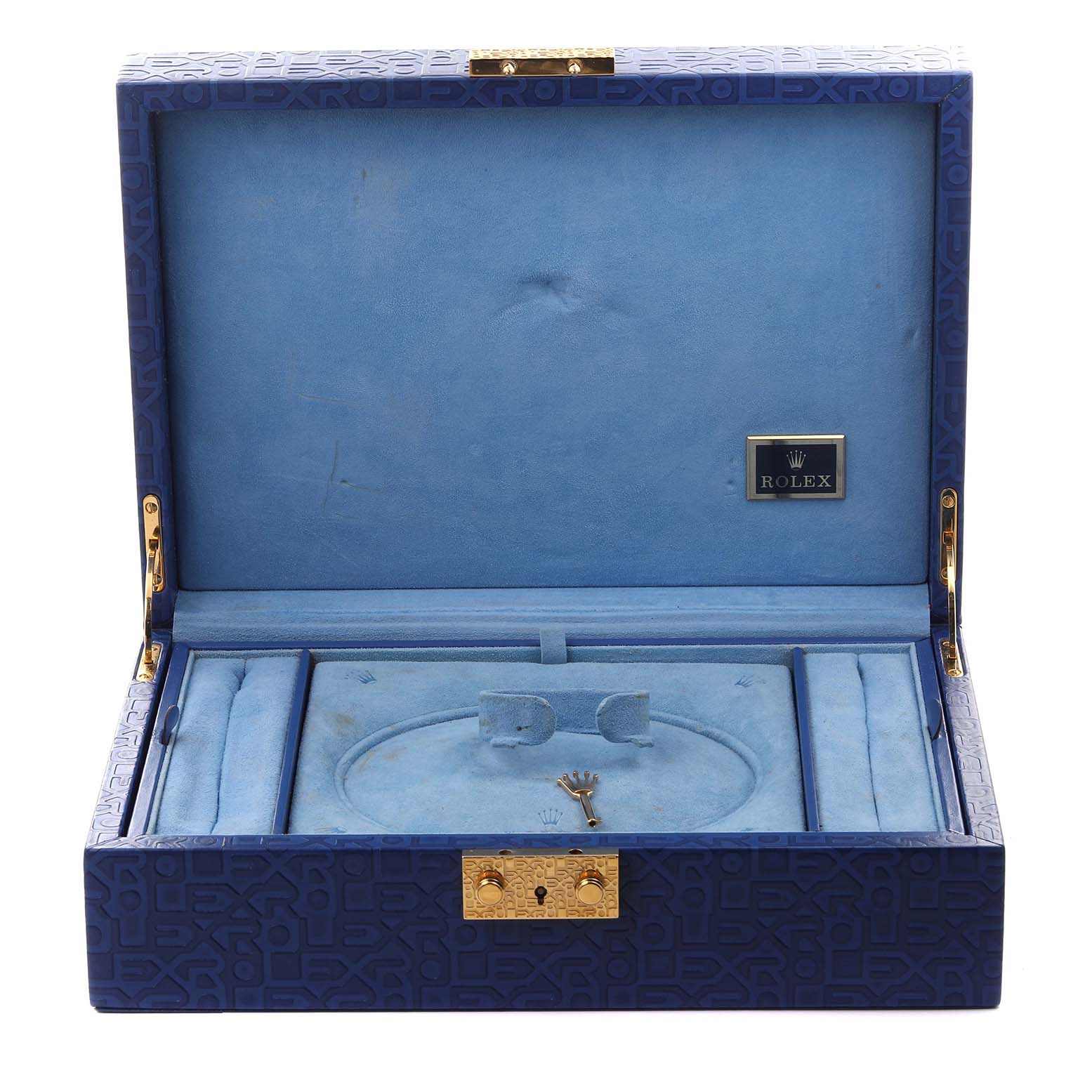 The image shows an open Rolex Pearlmaster 69298 Women's Yellow Gold White Dial 69298 Women's Yellow Gold White Dial watch box from a top angle, revealing compartments and a key inside.