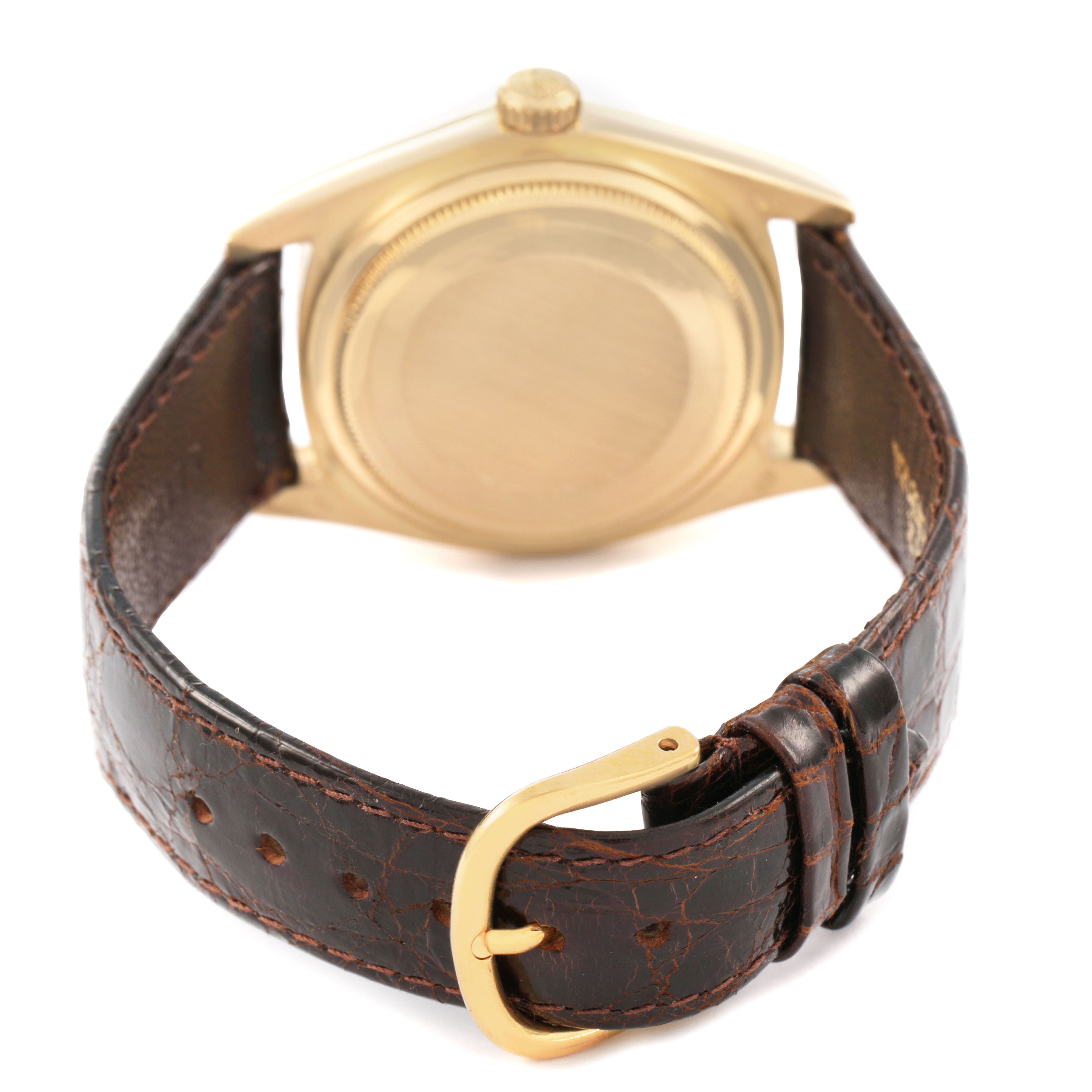 The image shows the back and side of the Rolex President 18038 Men's Yellow Gold Champagne Dial watch, highlighting the gold case and leather strap with a buckle.