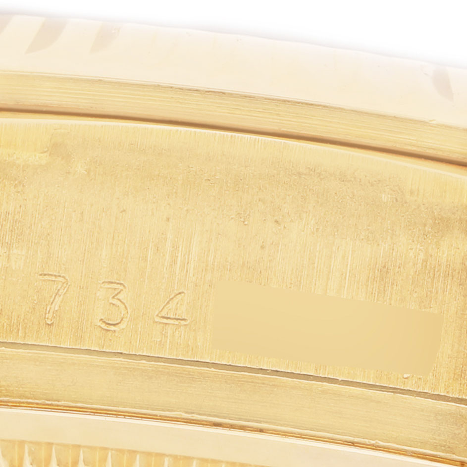 The image shows an engraved detail on the side of the Rolex President 18038 Men's Yellow Gold Champagne Dial watch case.