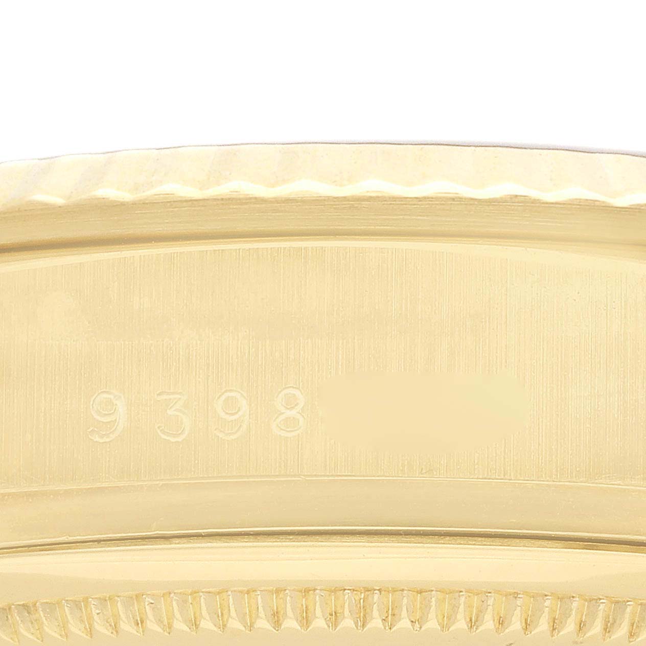 The image shows a close-up of the bezel and case side of a Rolex President 18038 Men
s Yellow Gold Champagne Dial model.