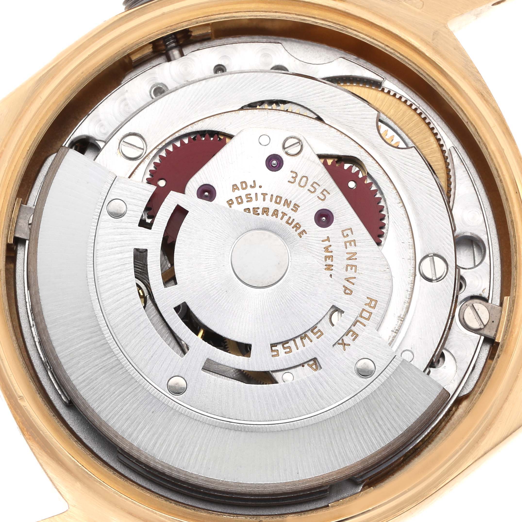The image shows the movement and internal mechanisms of a Rolex President 18038 Men
s Yellow Gold Champagne Dial model watch, viewed from the back.