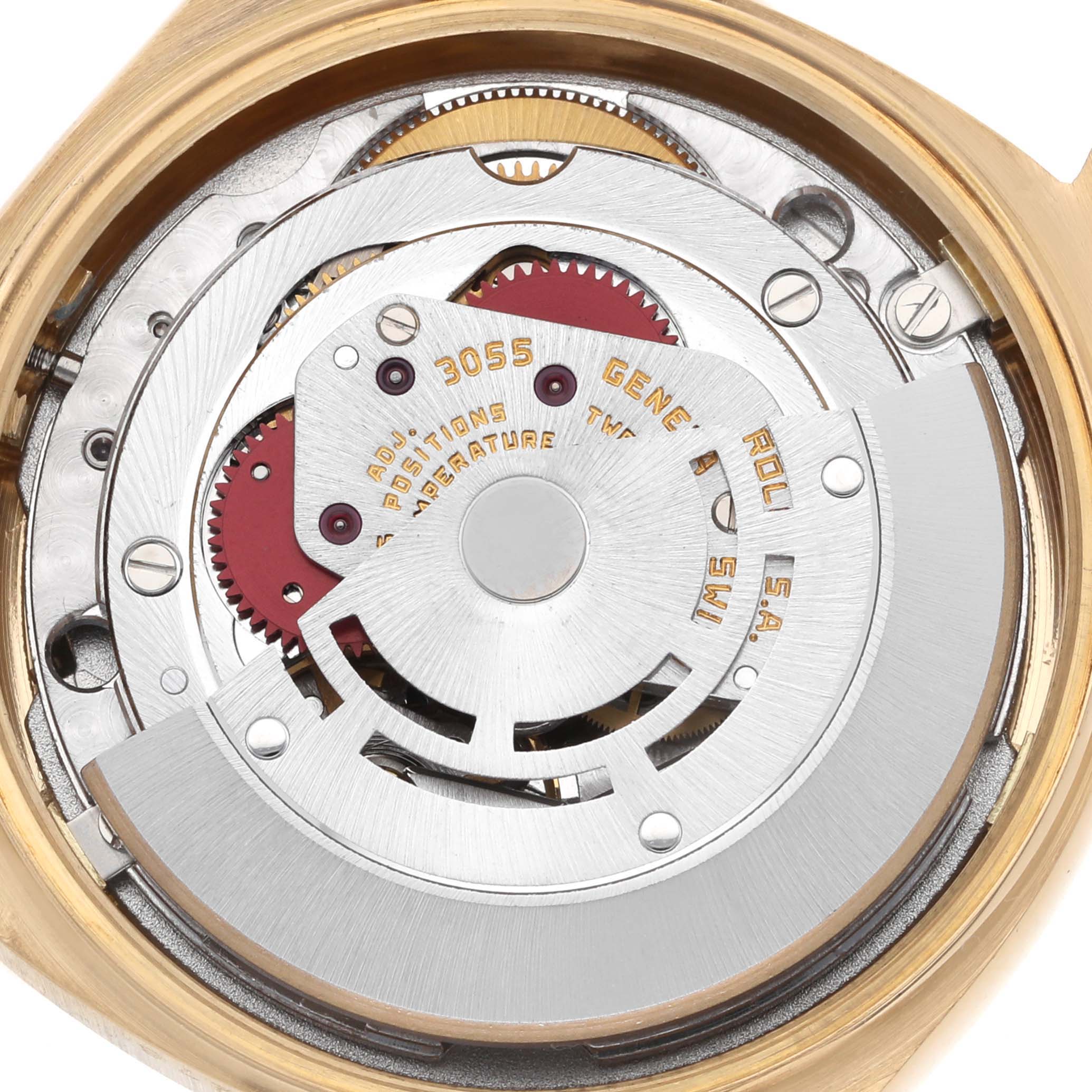 The image shows a close-up of the movement mechanism of a Rolex President 18038 Men
s Yellow Gold Champagne Dial watch.
