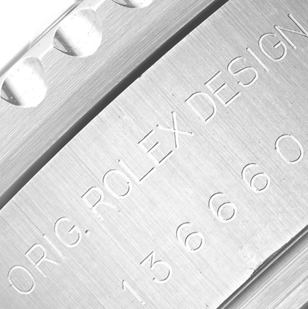 The image shows an engraved side view of the Rolex Sea-Dweller 136660 Men
s Stainless Steel Black Dial 136660 Men
s Stainless Steel Black Dial
s case with model details.