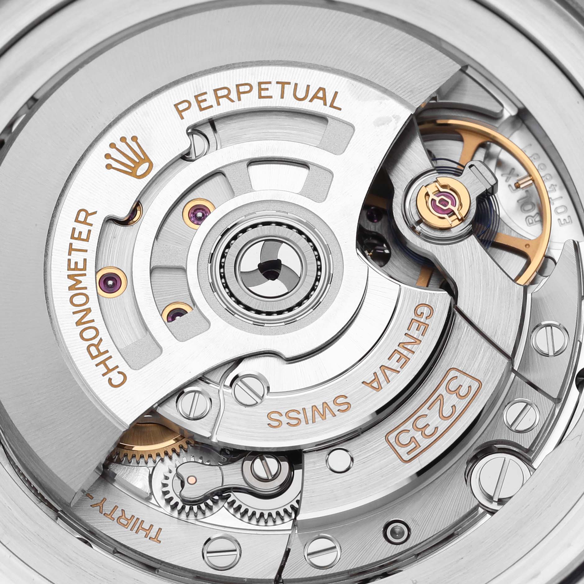 The image shows a close-up of the Rolex Sea-Dweller 136660 Men
s Stainless Steel Black Dial 136660 Men
s Stainless Steel Black Dial
s movement, highlighting gears and engravings.