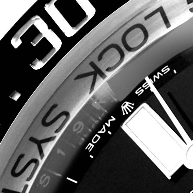 The image shows a close-up of the bezel and dial edge of the Rolex Sea-Dweller 136660 Men
s Stainless Steel Black Dial 136660 Men
s Stainless Steel Black Dial watch, highlighting the "LOCK" text and part of the logo.