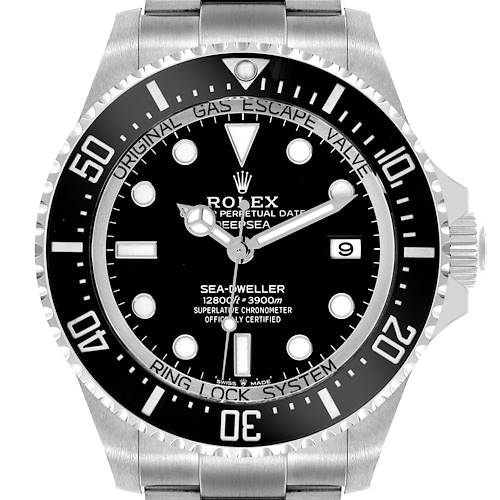 The Rolex Sea-Dweller watch is shown from a front angle, highlighting its black dial, bezel, date window, and stainless steel case.