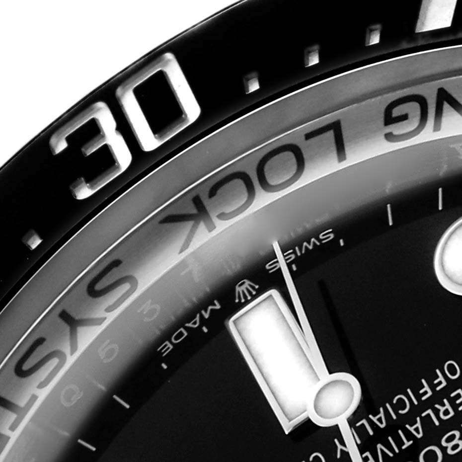 This close-up shot of the Rolex Sea-Dweller 126660 Men
s Stainless Steel Blue Dial shows part of the bezel with the "30" mark, the dial, and hour markers.