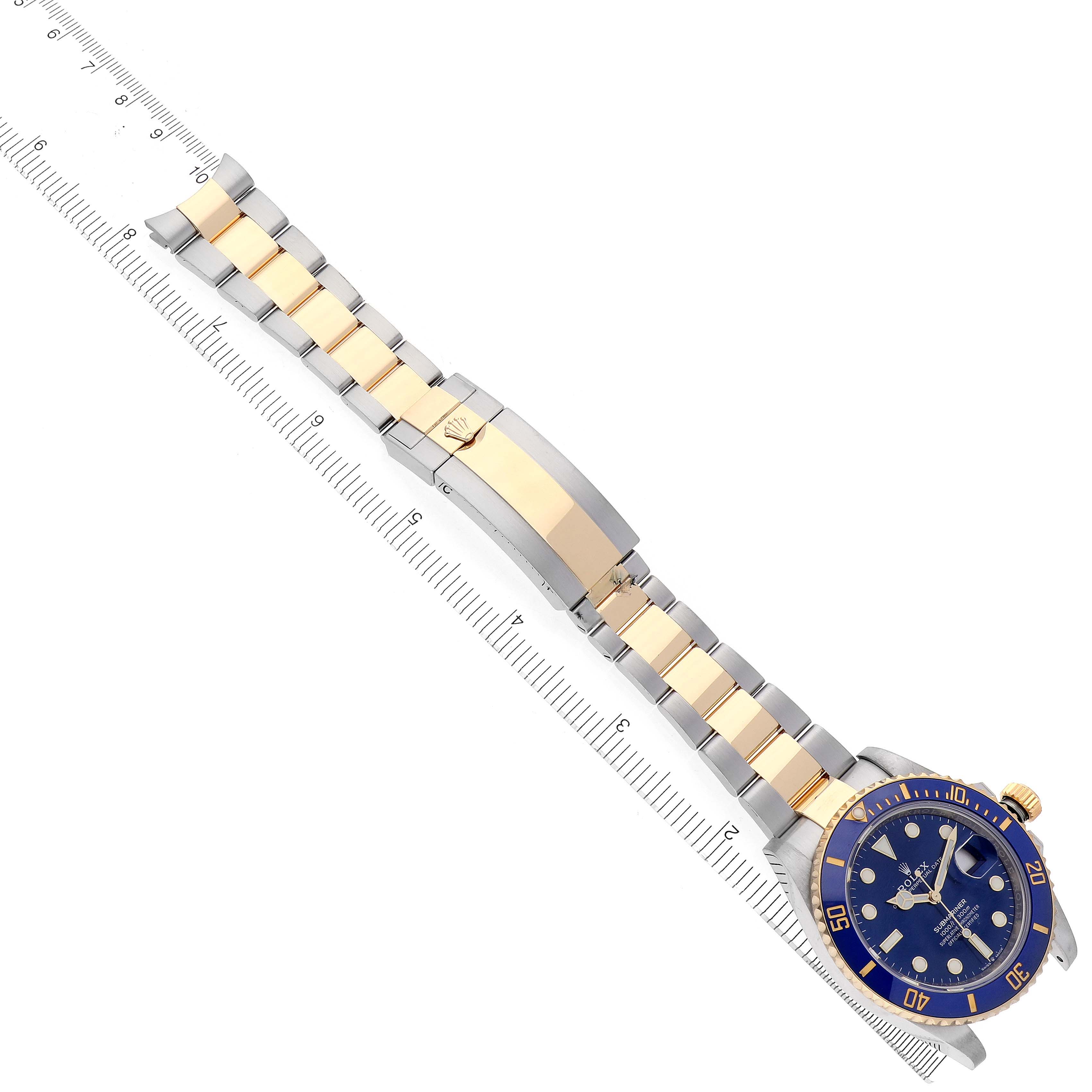 The image shows a top-down view of a Rolex Submariner 126613 Men's Steel and Gold (two tone) Blue Dial 126613 Men's Steel and Gold (two tone) Blue Dial watch, highlighting the bracelet, clasp, and dial.
