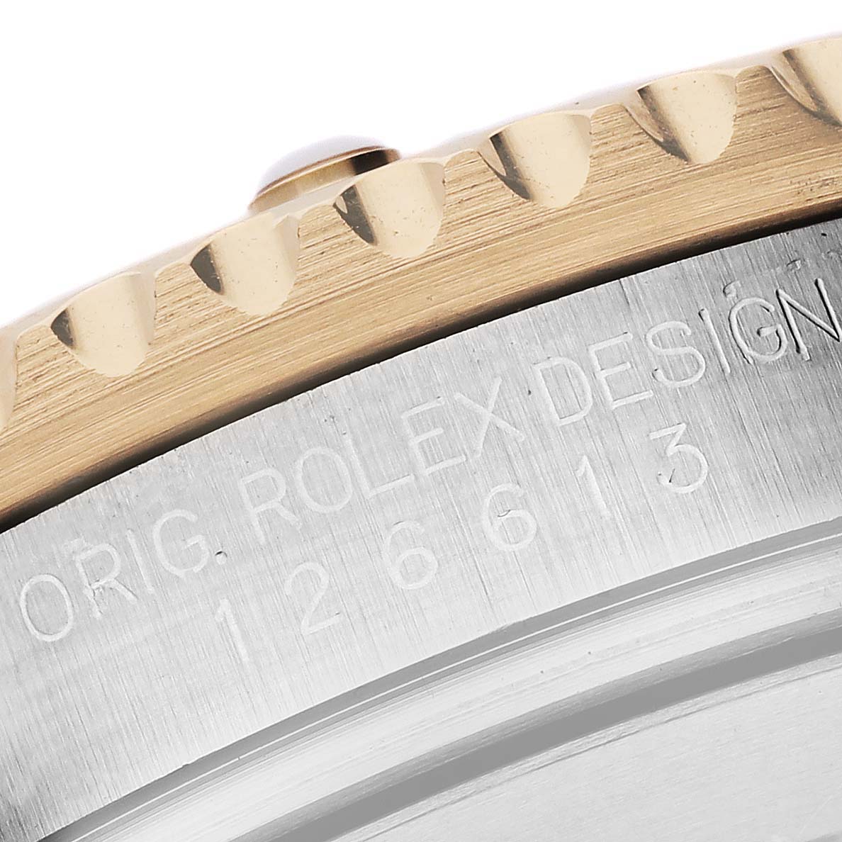 The image shows a close-up of the bezel edge and model engraving on a Rolex Submariner 126613 Men's Steel and Gold (two tone) Blue Dial 126613 Men's Steel and Gold (two tone) Blue Dial watch.