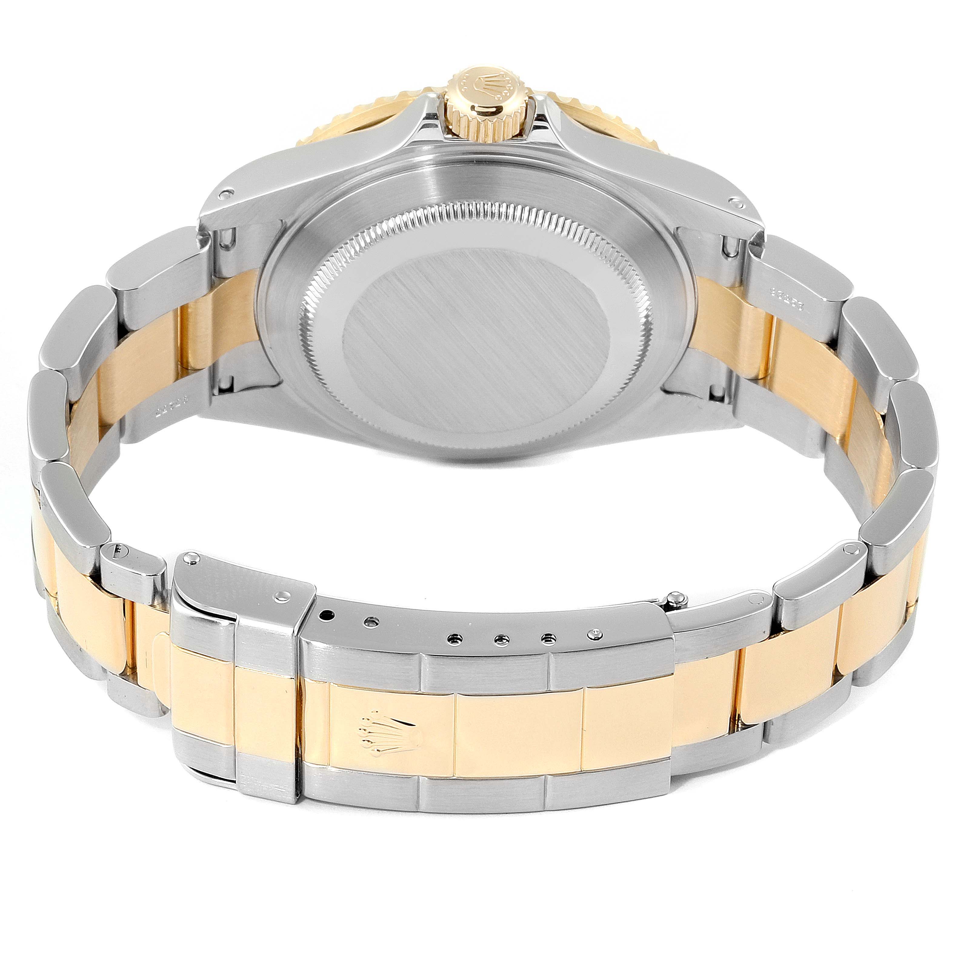 This image shows the back and bracelet of a Rolex Submariner 16613 Men's Steel and Gold (two tone) Black Dial 16613 Men's Steel and Gold (two tone) Black Dial watch, highlighting the case back and two-tone metal bracelet.