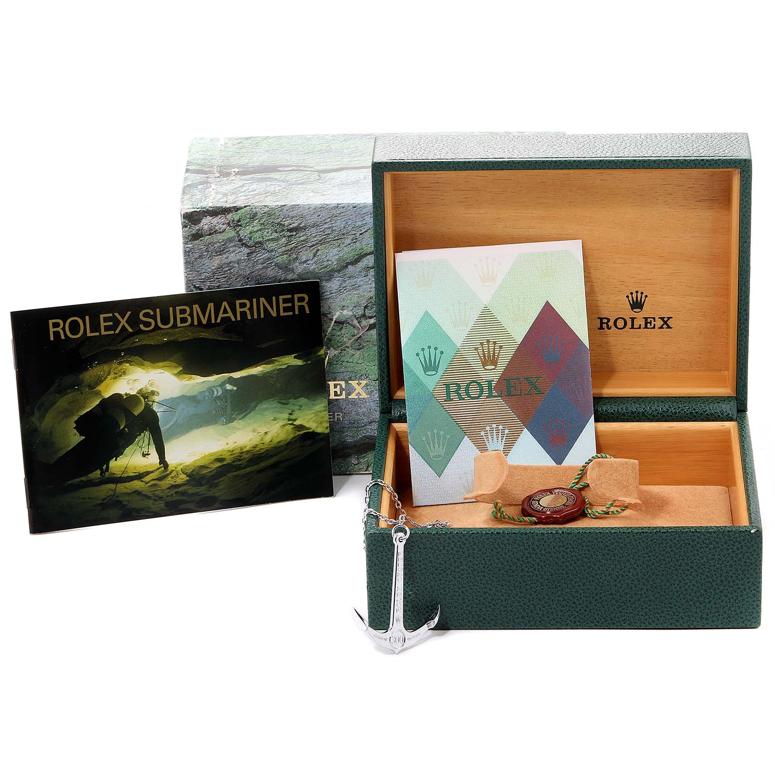 The image shows a Rolex Submariner 16613 Men's Steel and Gold (two tone) Black Dial 16613 Men's Steel and Gold (two tone) Black Dial watch box, instructions manual, booklet, and an anchor-themed accessory.