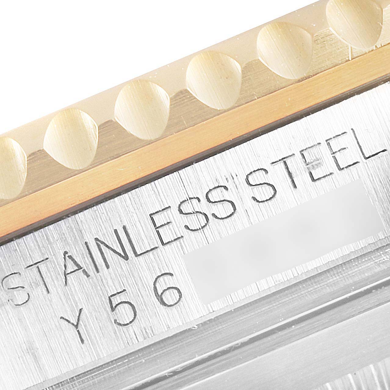 This close-up image of a Rolex Submariner 16613 Men's Steel and Gold (two tone) Black Dial 16613 Men's Steel and Gold (two tone) Black Dial shows the stainless steel case and partial view of the bezel.