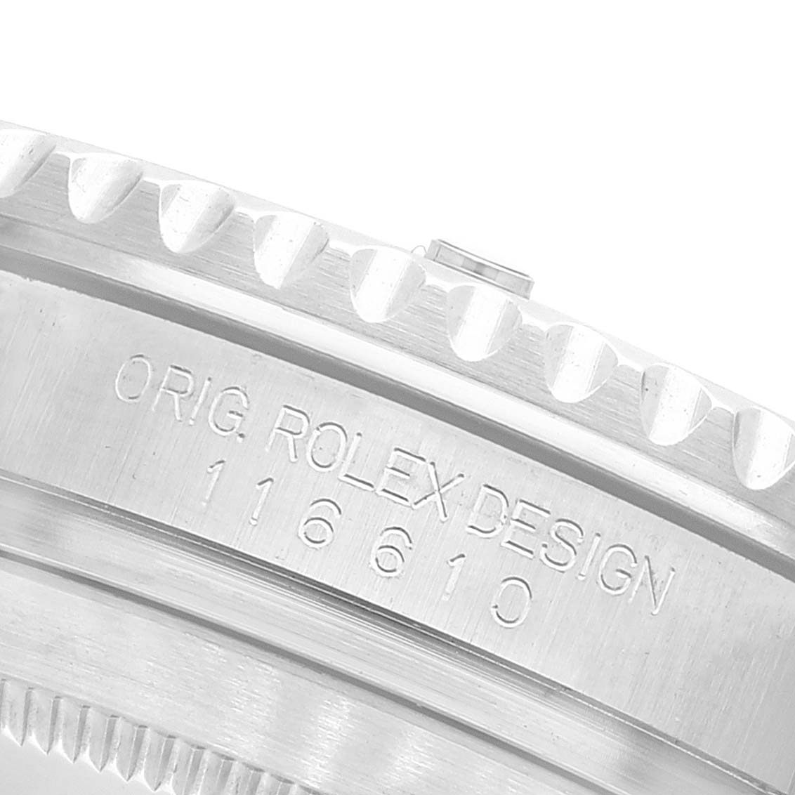 The image shows a close-up of the Rolex Submariner 116610 Men's Stainless Steel Black Dial 116610 Men's Stainless Steel Black Dial's bezel and case with the engraved model number "116610."