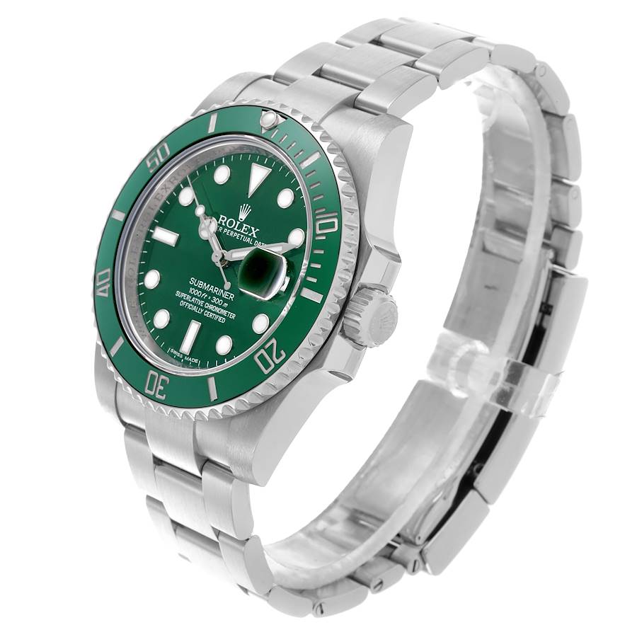 The Rolex Submariner is shown at a three-quarter angle, displaying the green bezel, dial, and stainless steel bracelet.