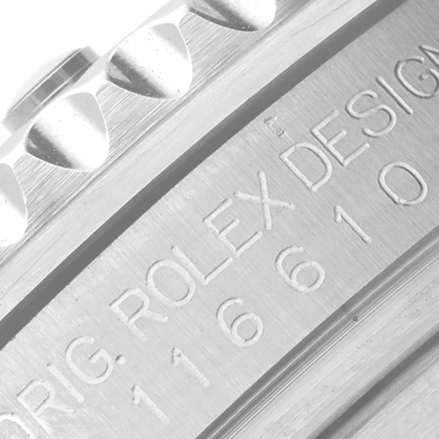 The image shows a close-up of the Rolex Submariner 116610LV Men's Stainless Steel Green Dial 116610LV Men's Stainless Steel Green Dial case edge, focusing on the branding and model number engraving.