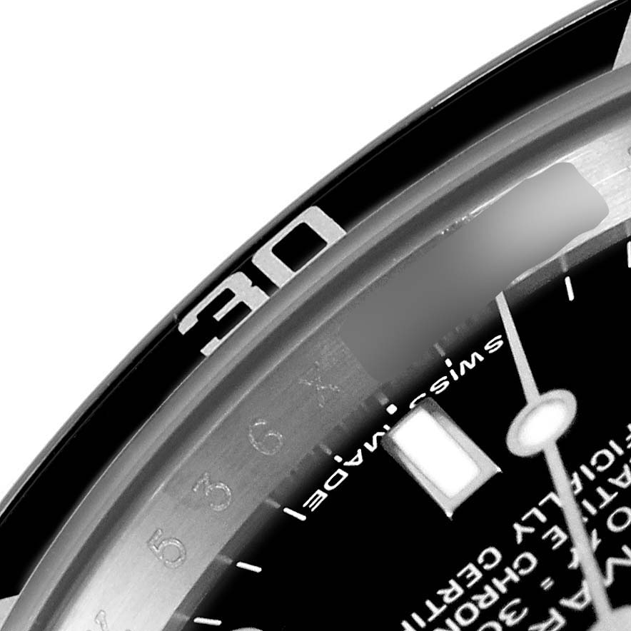 The image shows a close-up of the bezel and dial edge of a Rolex Submariner 14060 Men
s Stainless Steel Black Dial 14060 Men
s Stainless Steel Black Dial, highlighting numeral markers.