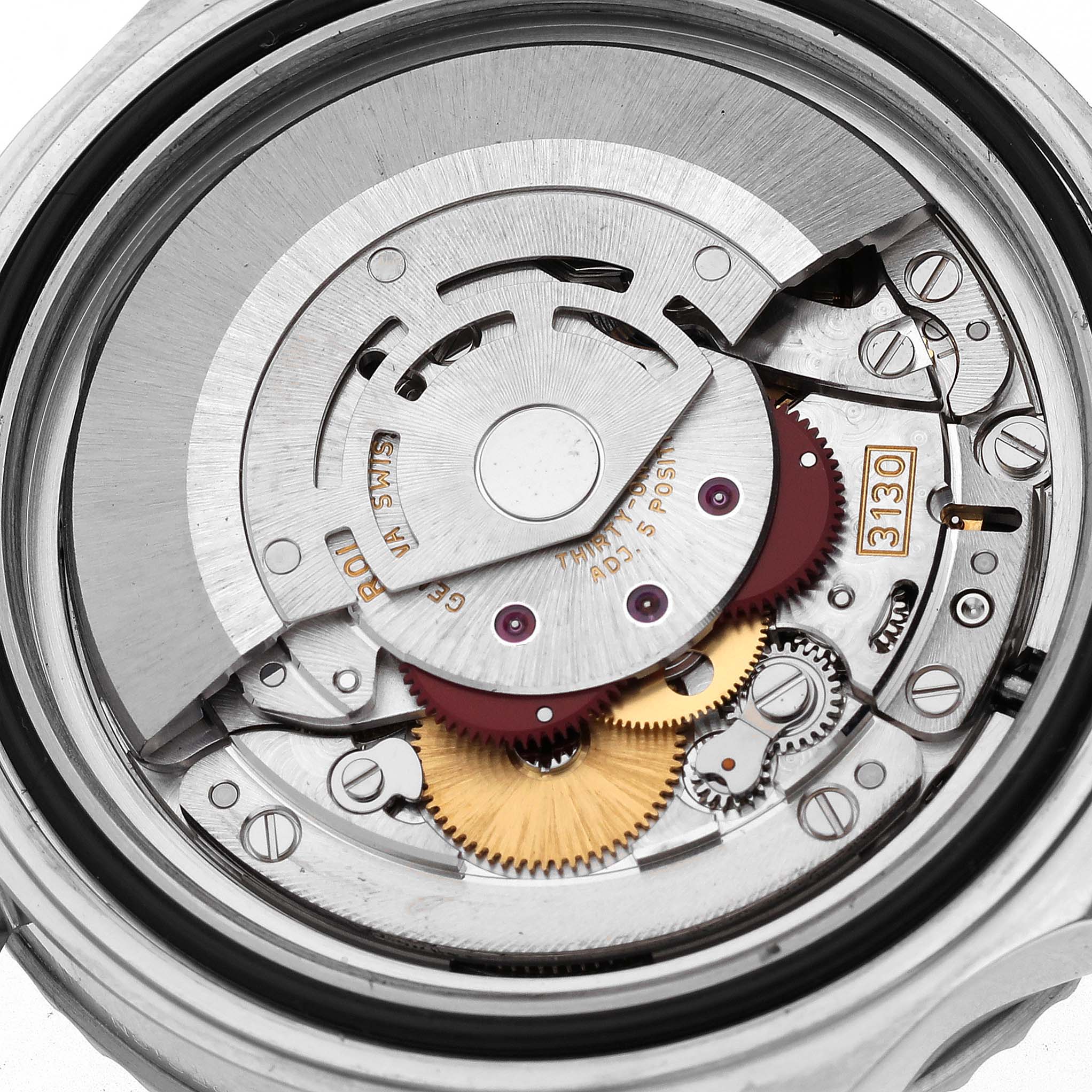 The image shows the movement components of a Rolex Submariner 14060 Men
s Stainless Steel Black Dial 14060 Men
s Stainless Steel Black Dial watch from a rear angle, revealing gears and rotors.