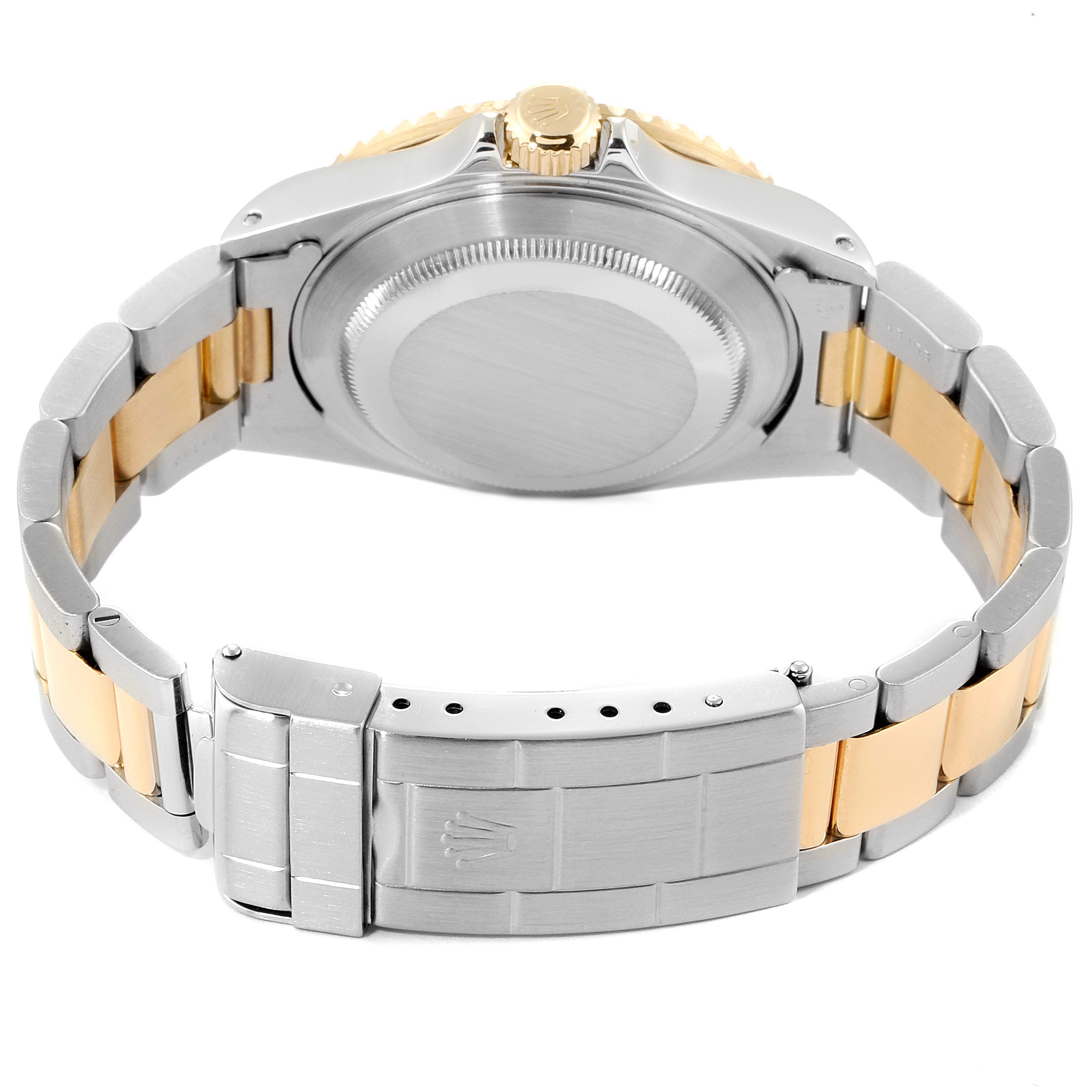 This image shows the back case and bracelet of a Rolex Submariner 16613 Men's Steel and Gold (two tone) Blue Dial 16613 Men's Steel and Gold (two tone) Blue Dial watch, highlighting its two-tone metal design.