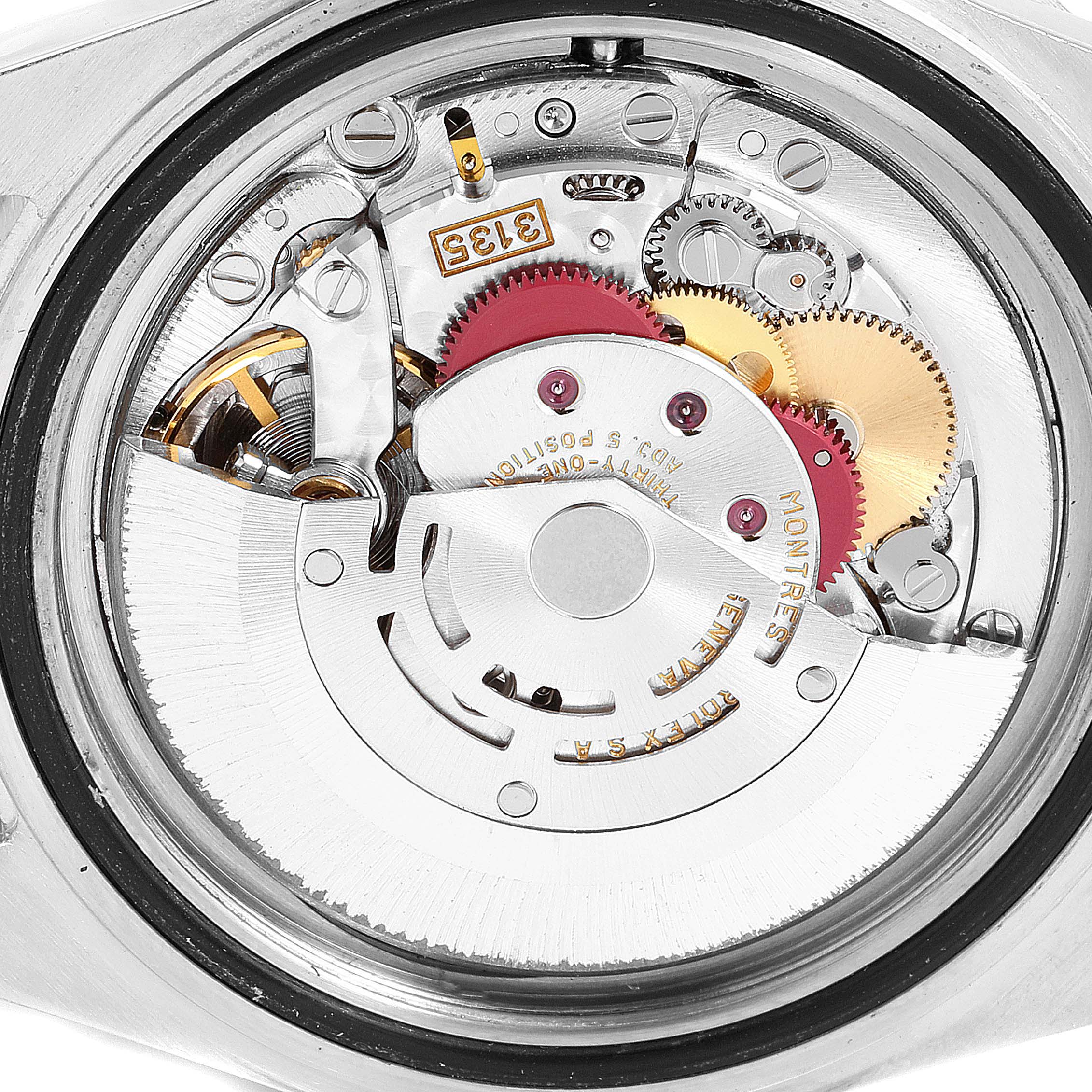 This image shows the intricate internal mechanism of a Rolex Submariner 16613 Men's Steel and Gold (two tone) Blue Dial 16613 Men's Steel and Gold (two tone) Blue Dial, including gears and the rotor, viewed from the back.