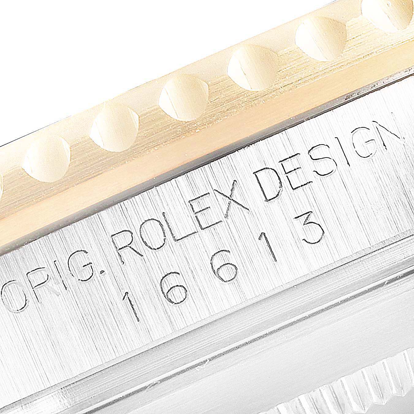 The image shows a close-up angle of the bezel and case side details on a Rolex Submariner 16613 Men's Steel and Gold (two tone) Blue Dial 16613 Men's Steel and Gold (two tone) Blue Dial model watch.