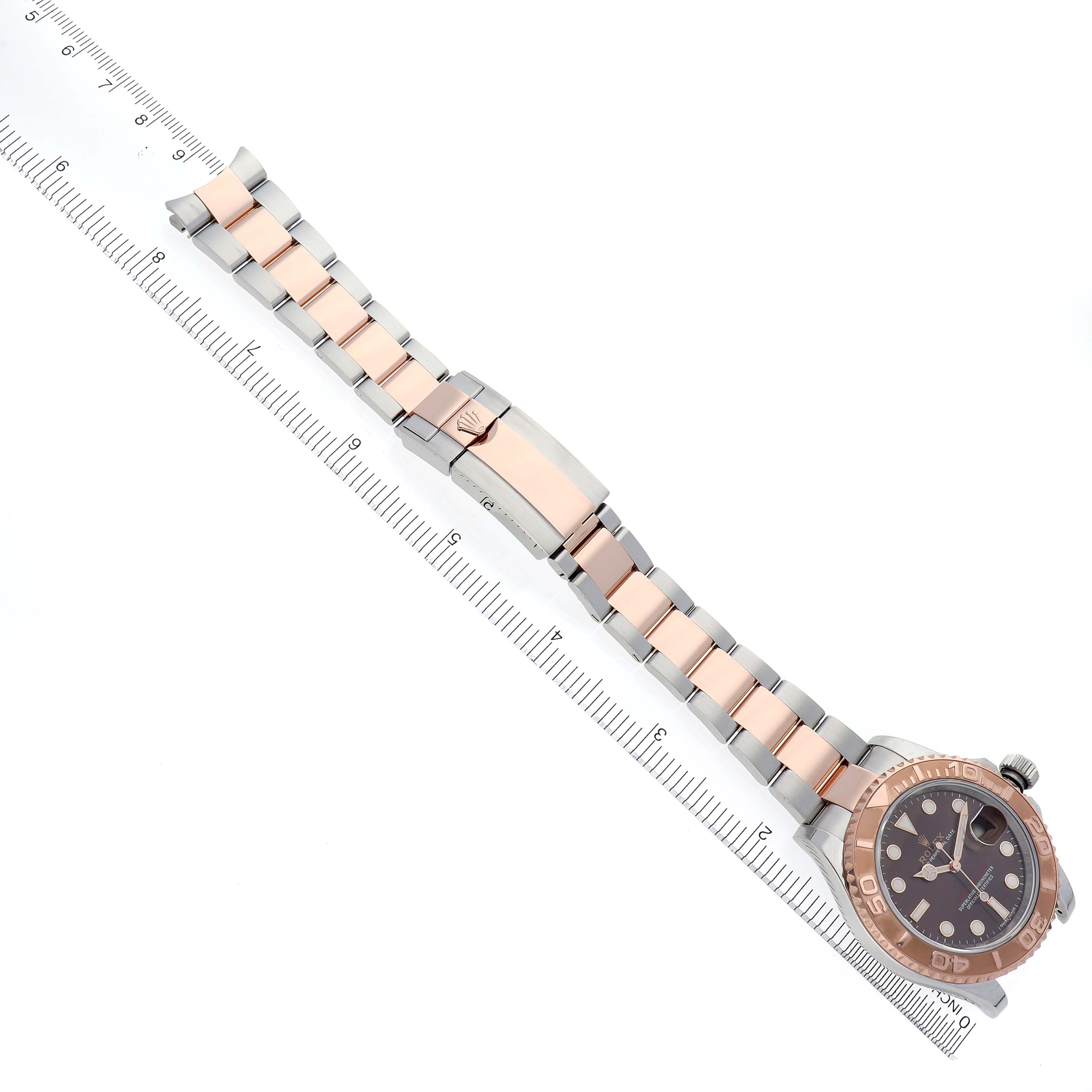The image shows a Rolex Yacht-Master 116621 Men's Steel and Gold (two tone) Brown Dial 116621 Men's Steel and Gold (two tone) Brown Dial watch at a top-down angle, highlighting its bracelet and clasp.