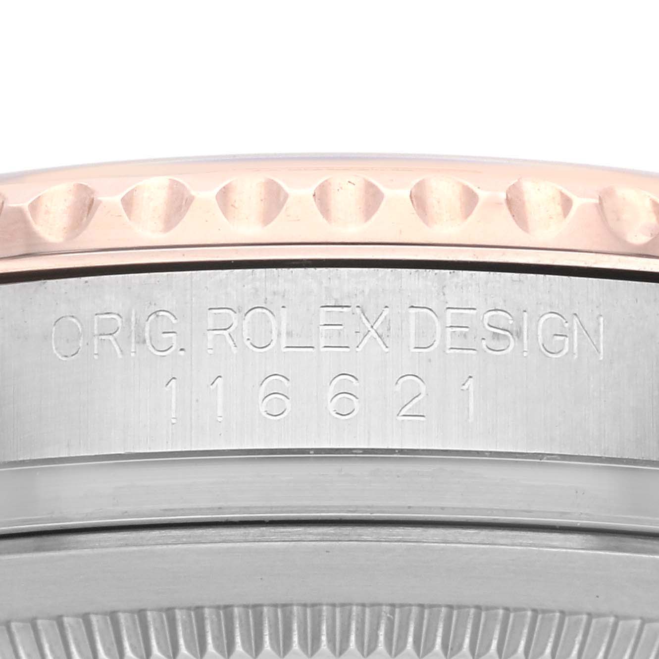 The image shows the side view of a Rolex Yacht-Master 116621 Men's Steel and Gold (two tone) Brown Dial 116621 Men's Steel and Gold (two tone) Brown Dial watch, focusing on the engraved case details.