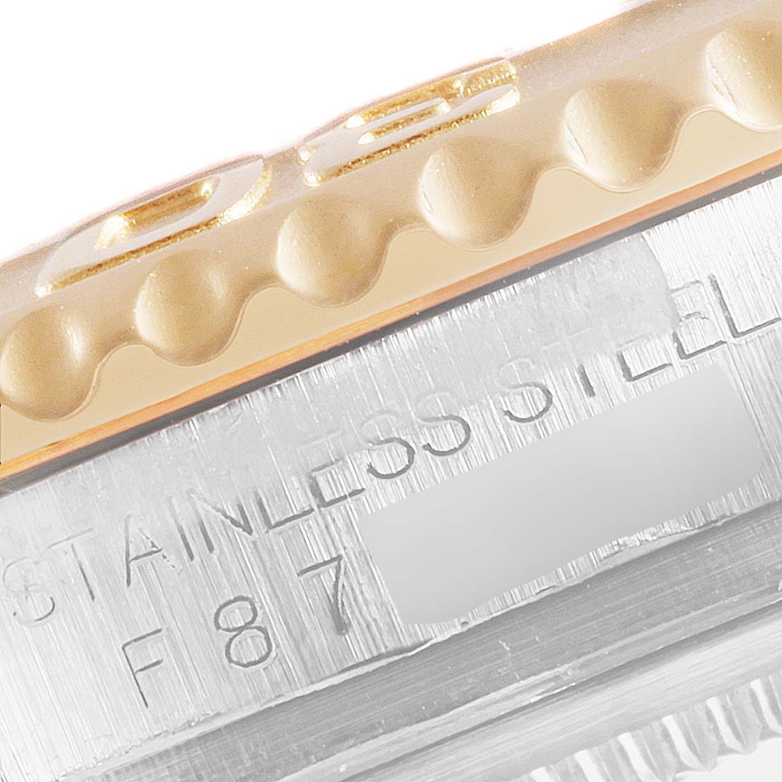 The image shows a close-up of the bezel and part of the stainless steel case on a Rolex Yacht-Master 16623 Men's Steel and Gold (two tone) Blue Dial 16623 Men's Steel and Gold (two tone) Blue Dial watch.