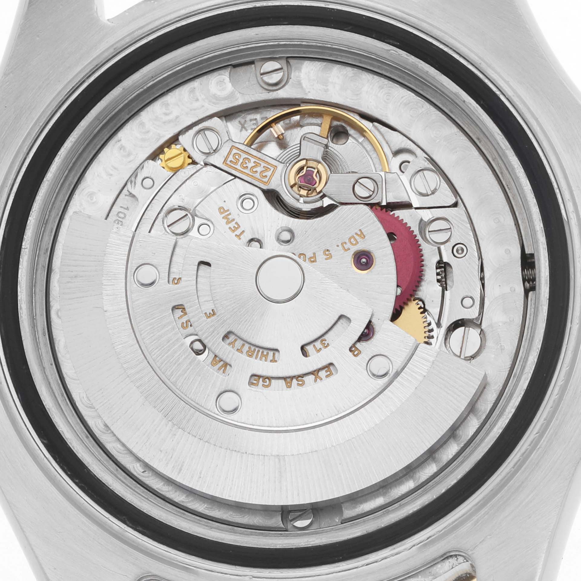The image shows the movement of a Rolex Yacht-Master 168623 Men
s Steel and Gold (two tone) White Dial watch viewed from the back, revealing its intricate mechanical parts.