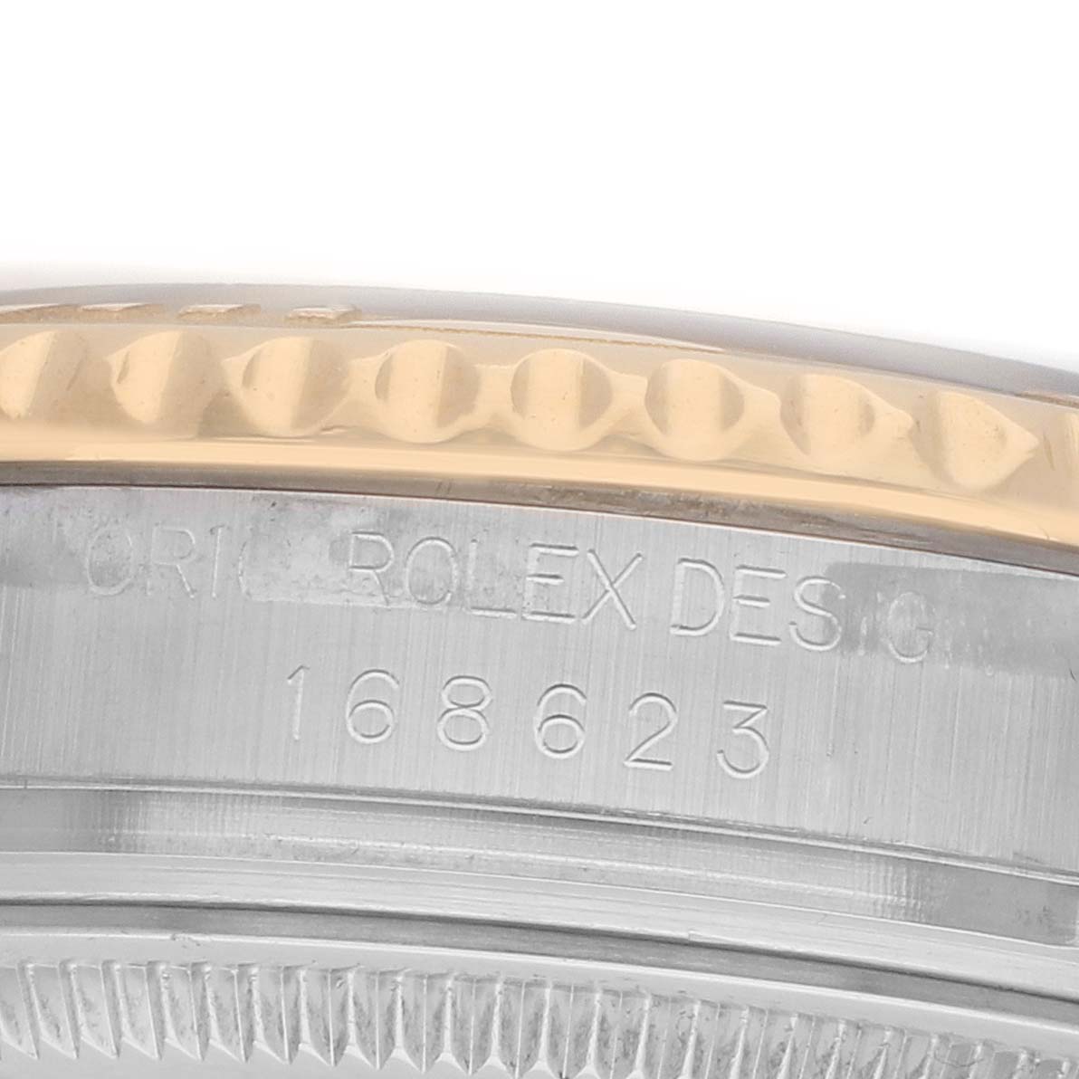 The image shows a close-up of the side of a Rolex Yacht-Master 168623 Men
s Steel and Gold (two tone) White Dial, highlighting the bezel, edge, and model engraving.