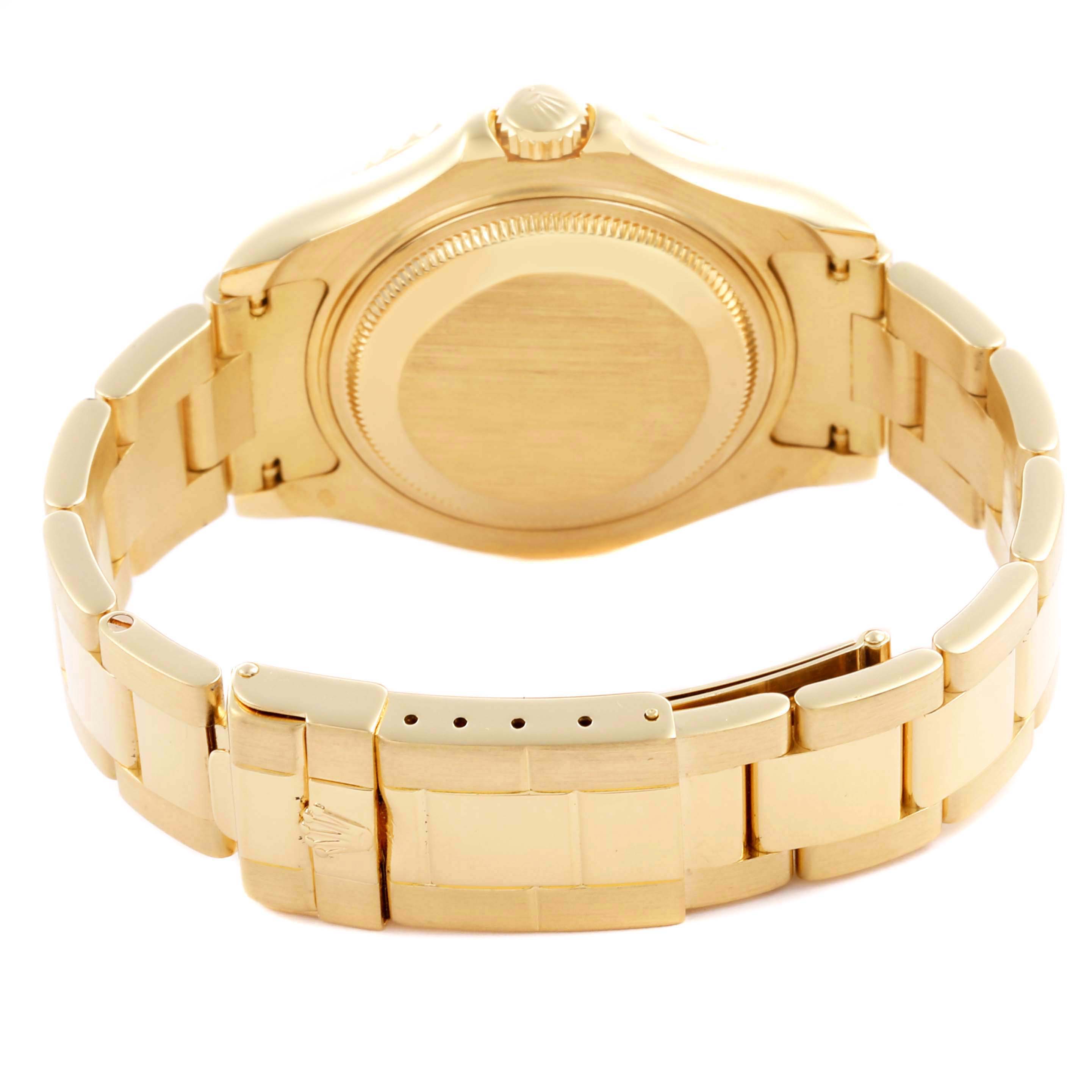The image shows the back view of a Rolex Yacht-Master 68628 Men's Yellow Gold White Dial 68628 Men's Yellow Gold White Dial watch, highlighting its clasp, bracelet, and case back.