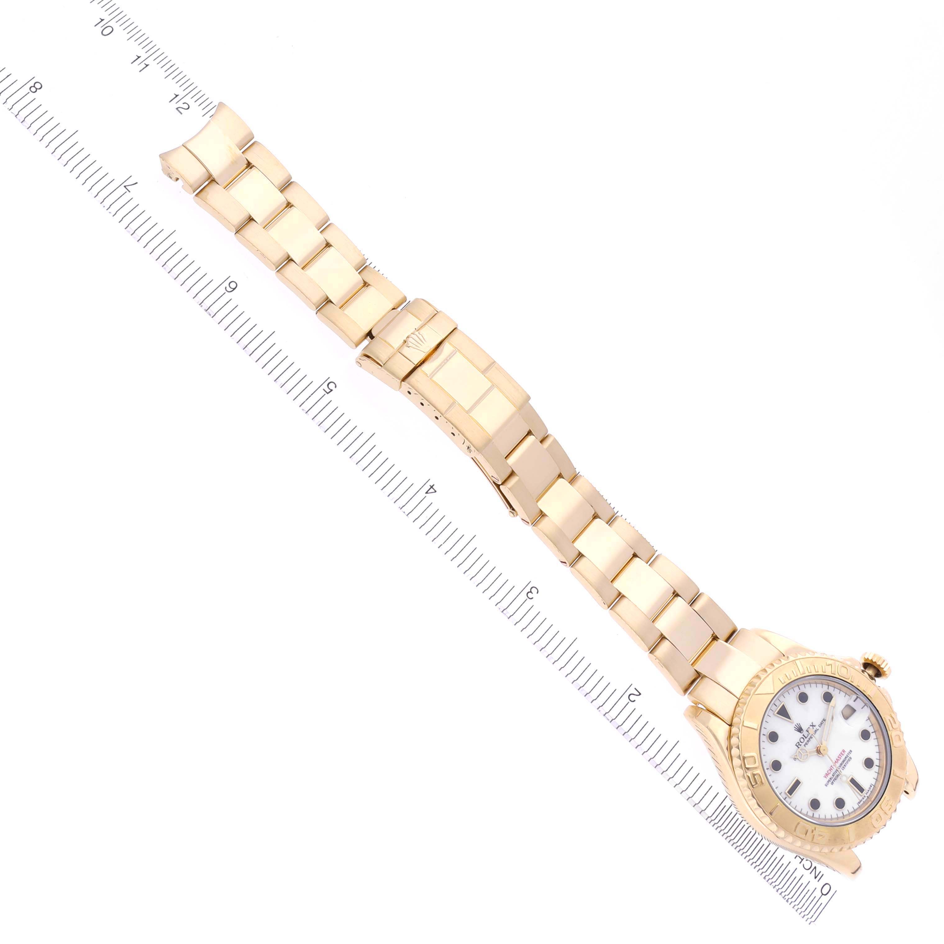 The Rolex Yacht-Master 68628 Men's Yellow Gold White Dial 68628 Men's Yellow Gold White Dial watch is shown from a top-down angle, displaying the dial, bezel, and full bracelet.
