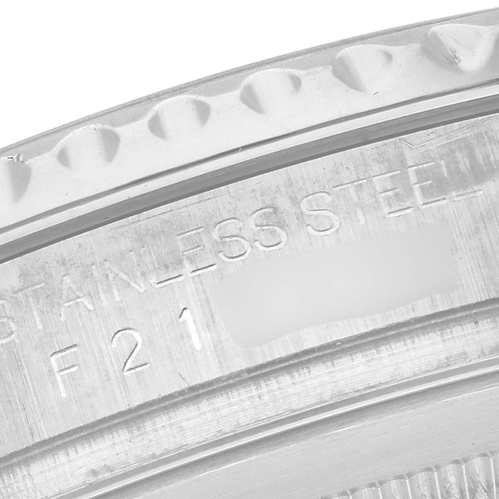 The image shows the side view of the bezel and part of the case back of a Rolex Yacht-Master Men's Stainless Steel Silver Dial Men's Stainless Steel Silver Dial, highlighting the stainless steel engraving.