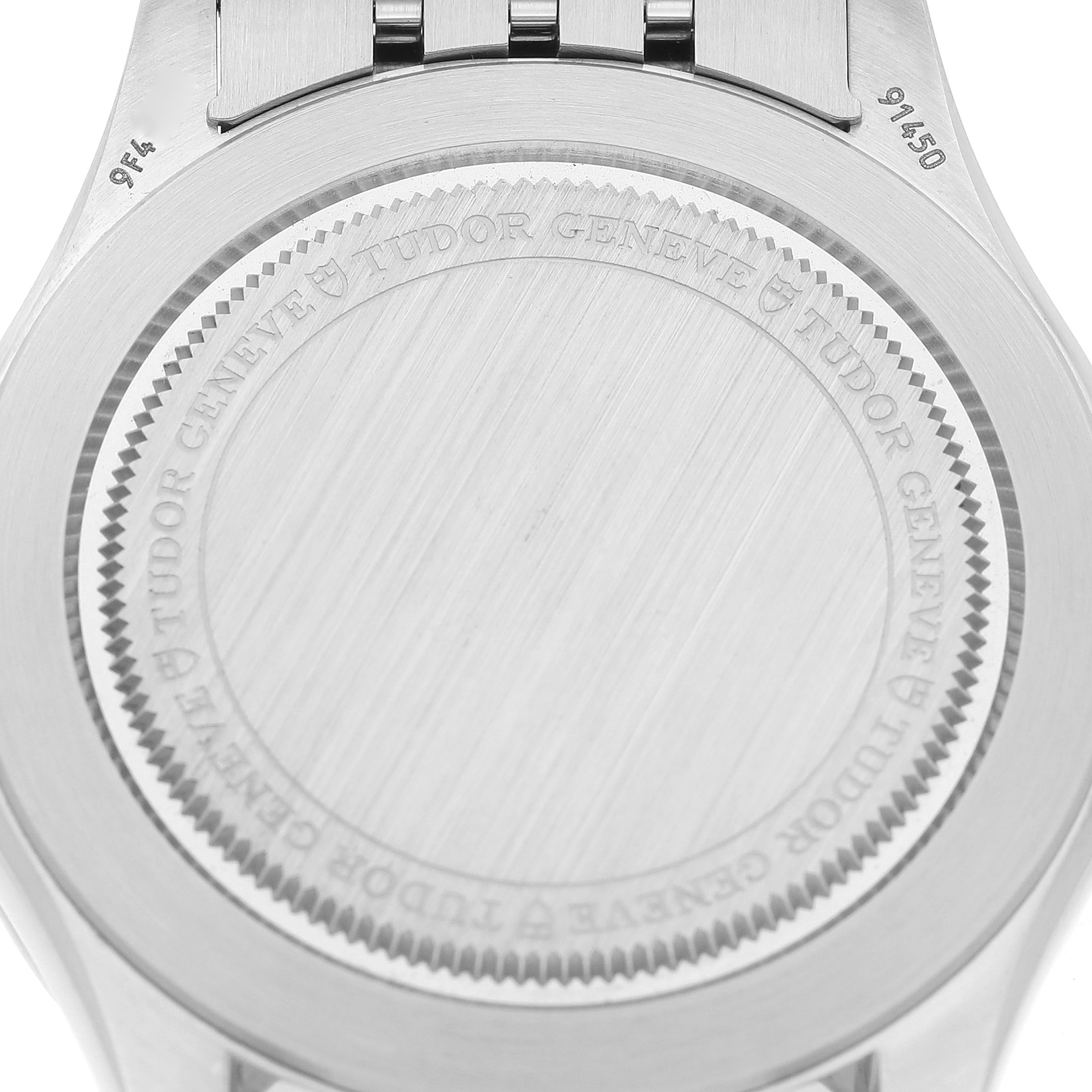 The image shows the back case of the Tudor 1926 M91450-0001 Men's Stainless Steel Silver Dial watch, viewed from the rear with engraved branding.