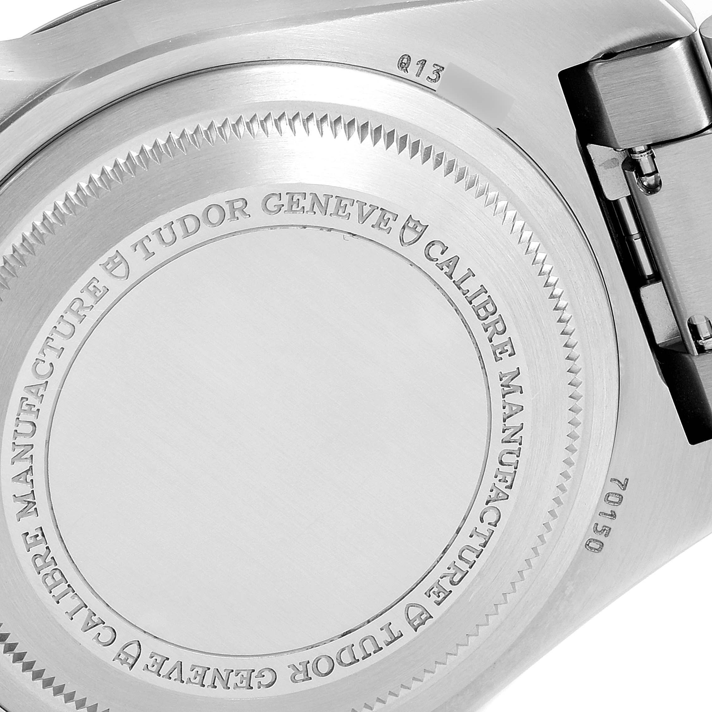 The image shows the case back and part of the bracelet clasp of the Tudor Heritage Black Bay M70150-0001 Men
s Stainless Steel Black Dial M70150-0001 Men
s Stainless Steel Black Dial watch.