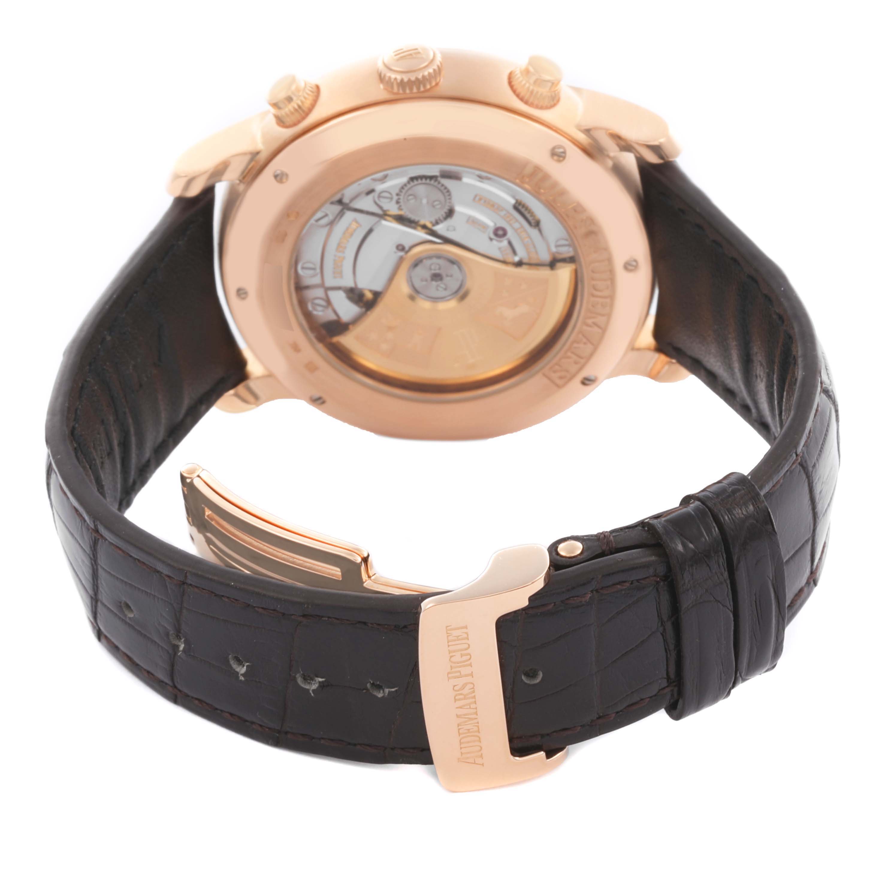 The image shows the back view of an Audemars Piguet Jules 26100OR.OO.D088CR.01 Men's Rose Gold White Dial 26100OR.OO.D088CR.01 Men's Rose Gold White Dial watch, highlighting its movement and leather strap.