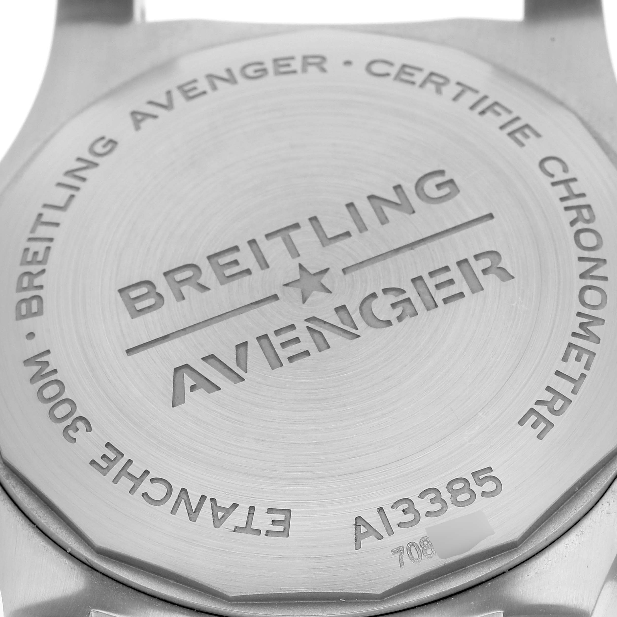 The image shows the back case of a Breitling Avenger A13385 Men's Stainless Steel Black Dial A13385 Men's Stainless Steel Black Dial watch, highlighting the engraved model details and certifications.