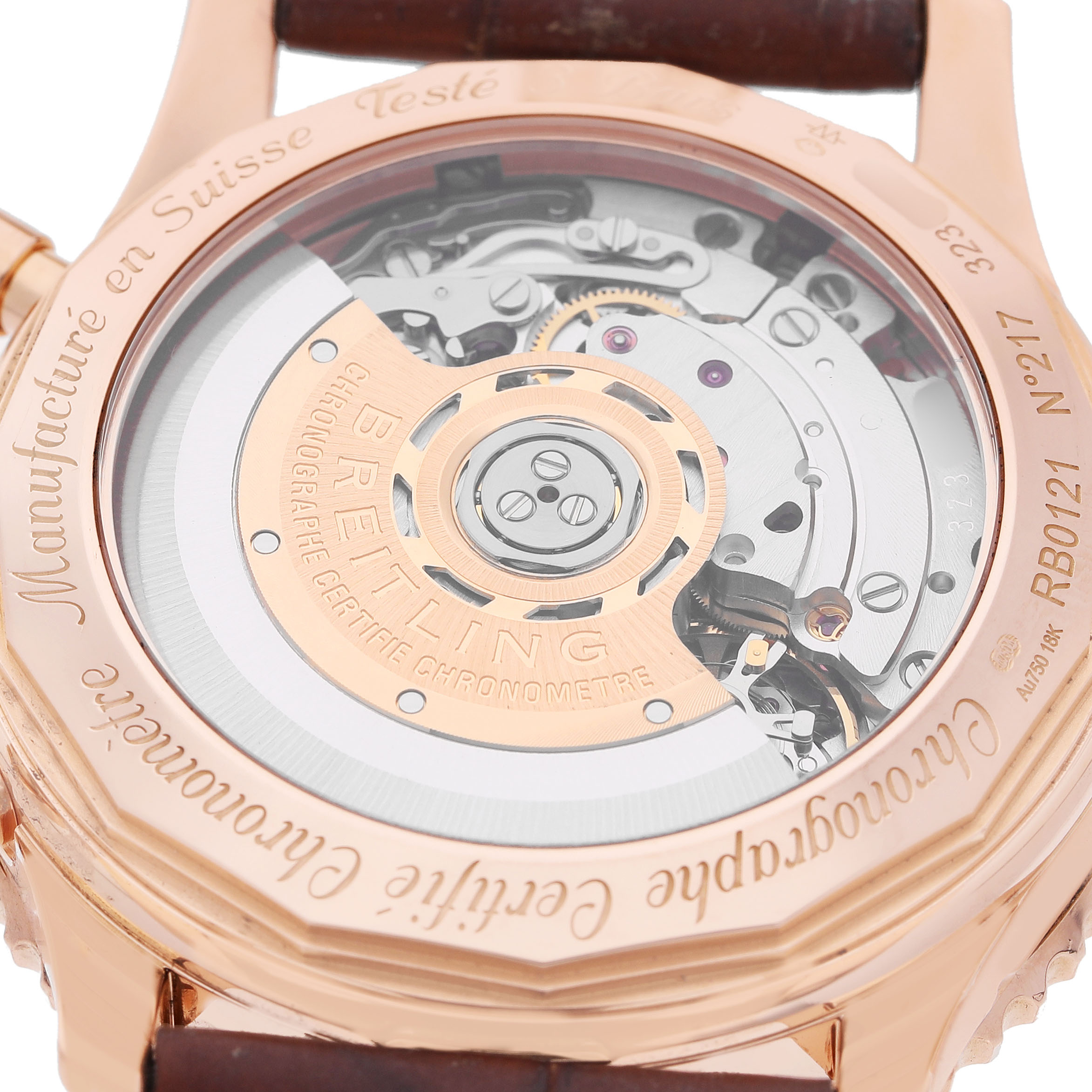 The image shows the transparent case back of a Breitling Navitimer RB0121211C1P4 Men's Rose Gold Blue Dial, revealing the movement and rotor.