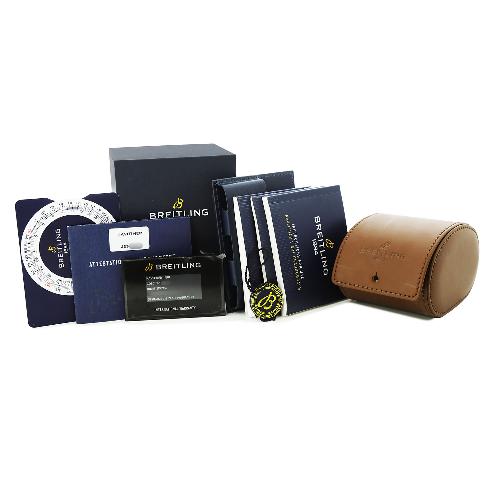 The image shows the Breitling Navitimer RB0121211C1P4 Men's Rose Gold Blue Dial watch accessories, including books, a warranty card, and a leather case, from a front angle.