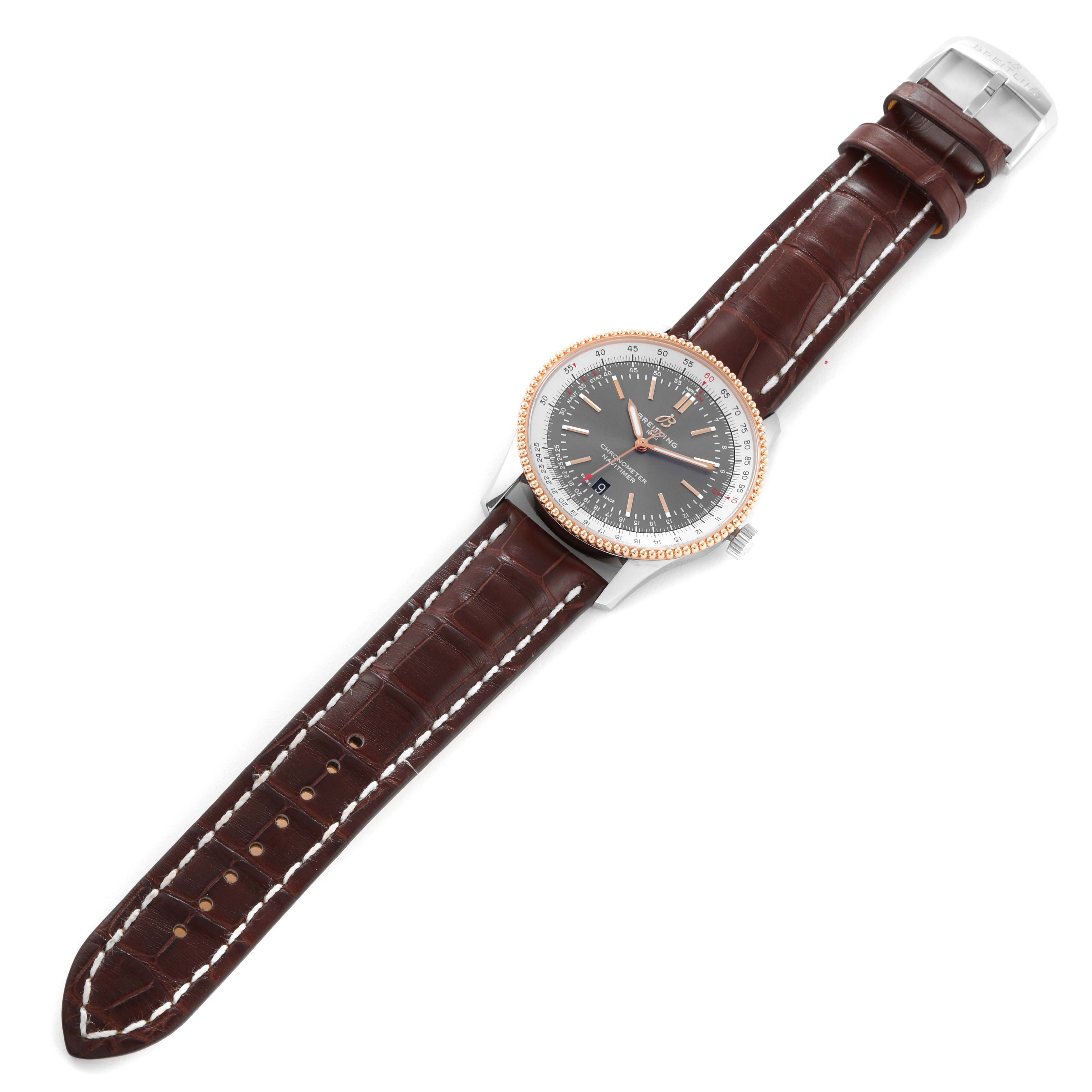 The Breitling Navitimer U17326211M1P1 Men
s Stainless Steel Grey Dial U17326211M1P1 Men
s Stainless Steel Grey Dial watch is shown from a top-down angle, displaying its face, bezel, strap, and buckle.