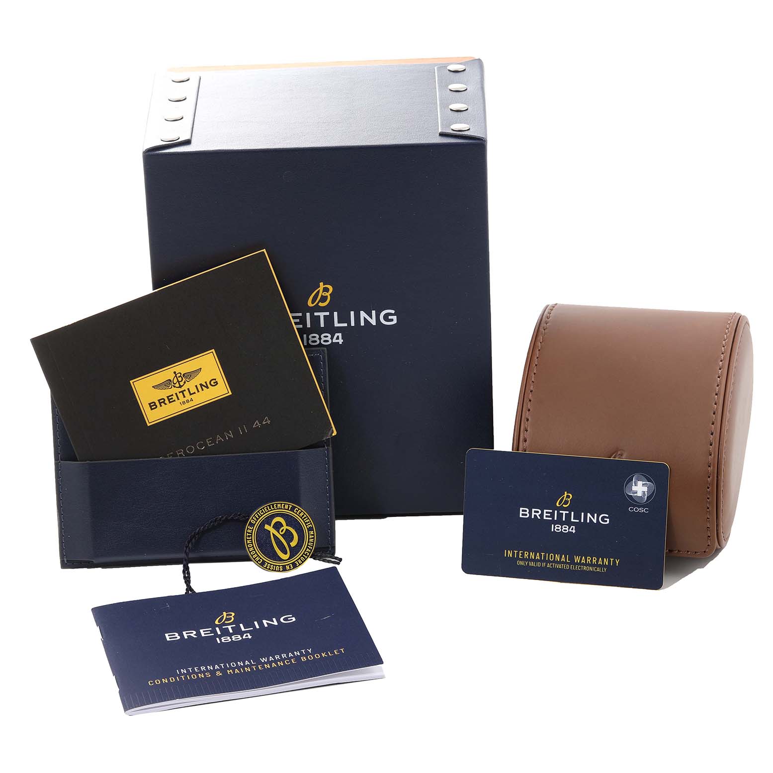 The image shows the Breitling Superocean M17368 Men's Stainless Steel Blue Dial M17368 Men's Stainless Steel Blue Dial watch's box, manual, warranty card, and leather travel case.